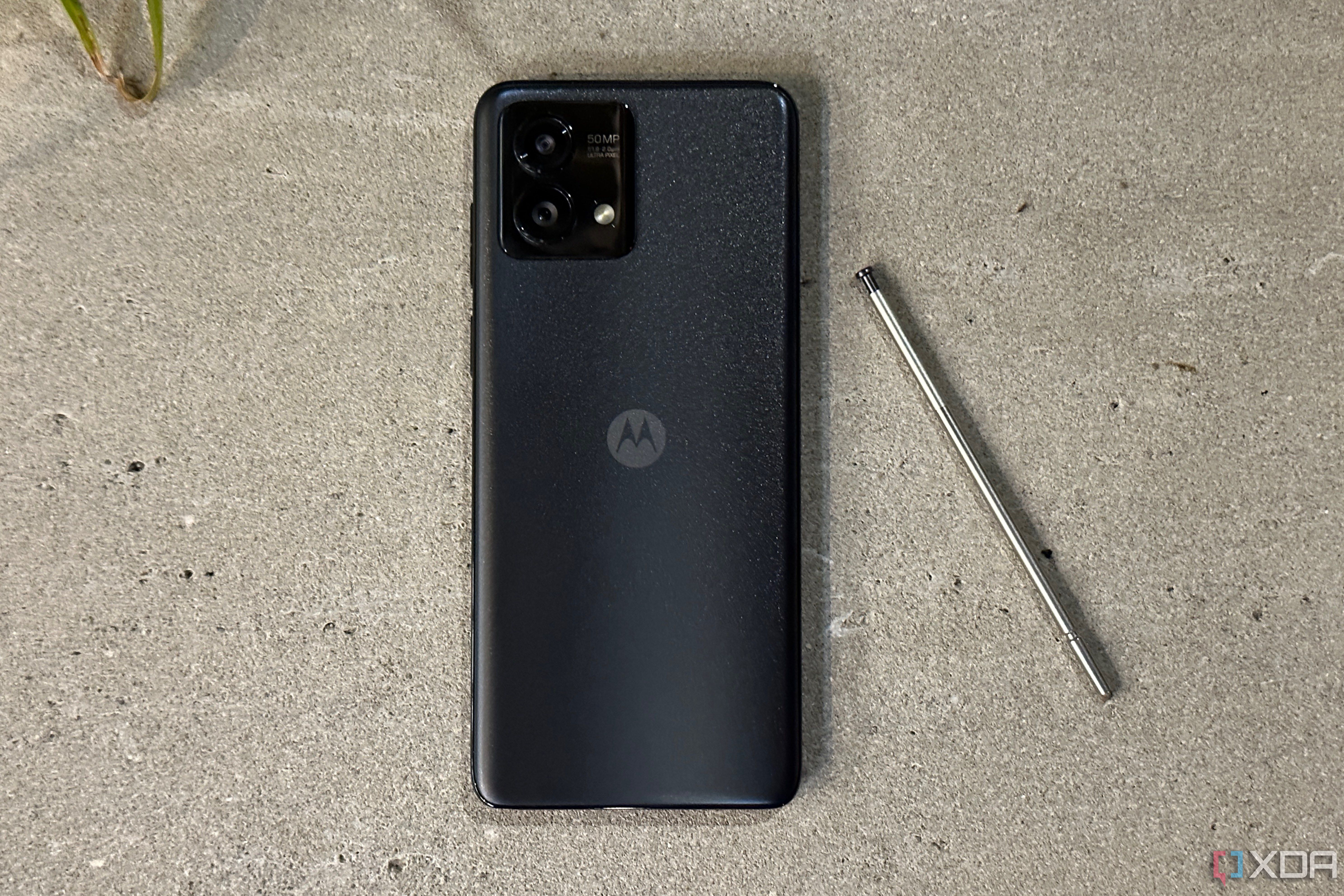 The Moto G Stylus (2023) with the stylus beside the phone.