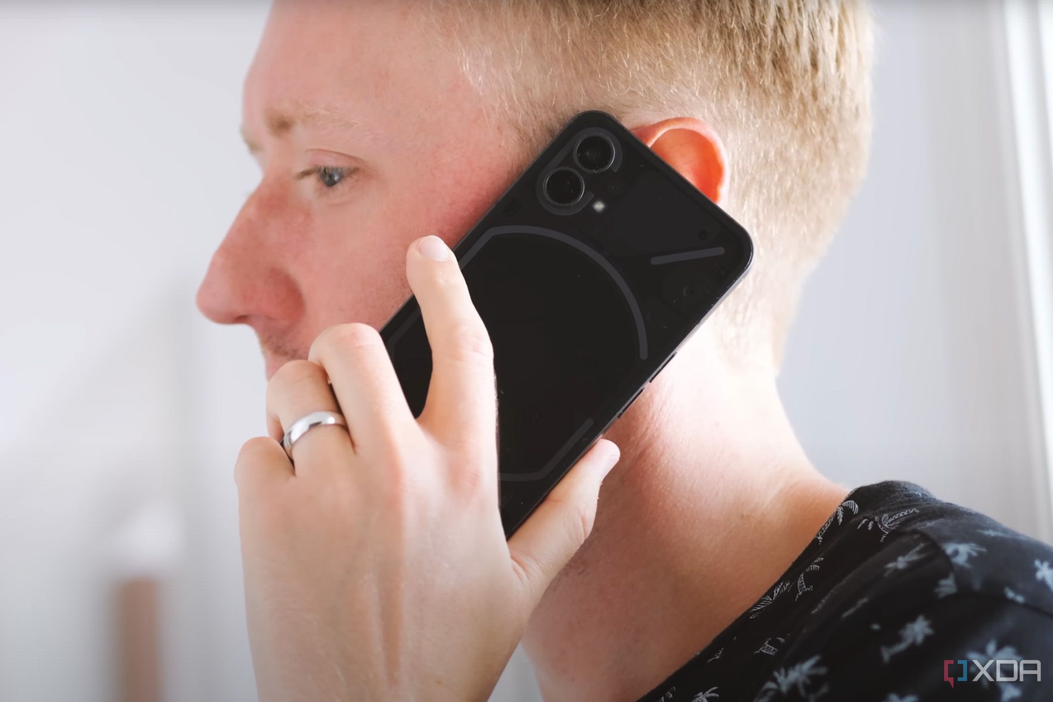 Person on a call using the black Nothing Phone 1.
