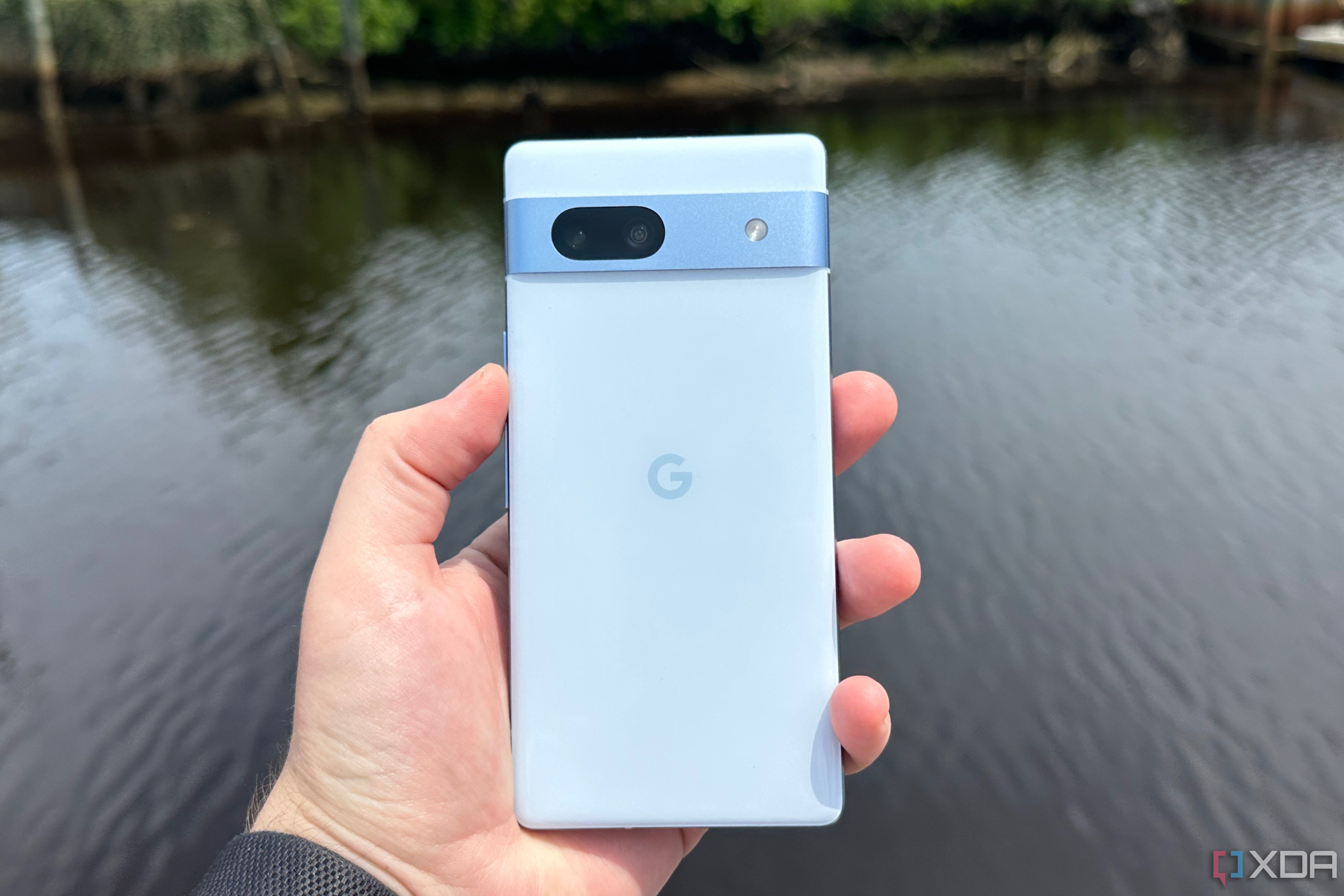 A Pixel 7a in the Sea colorway near an inlet.