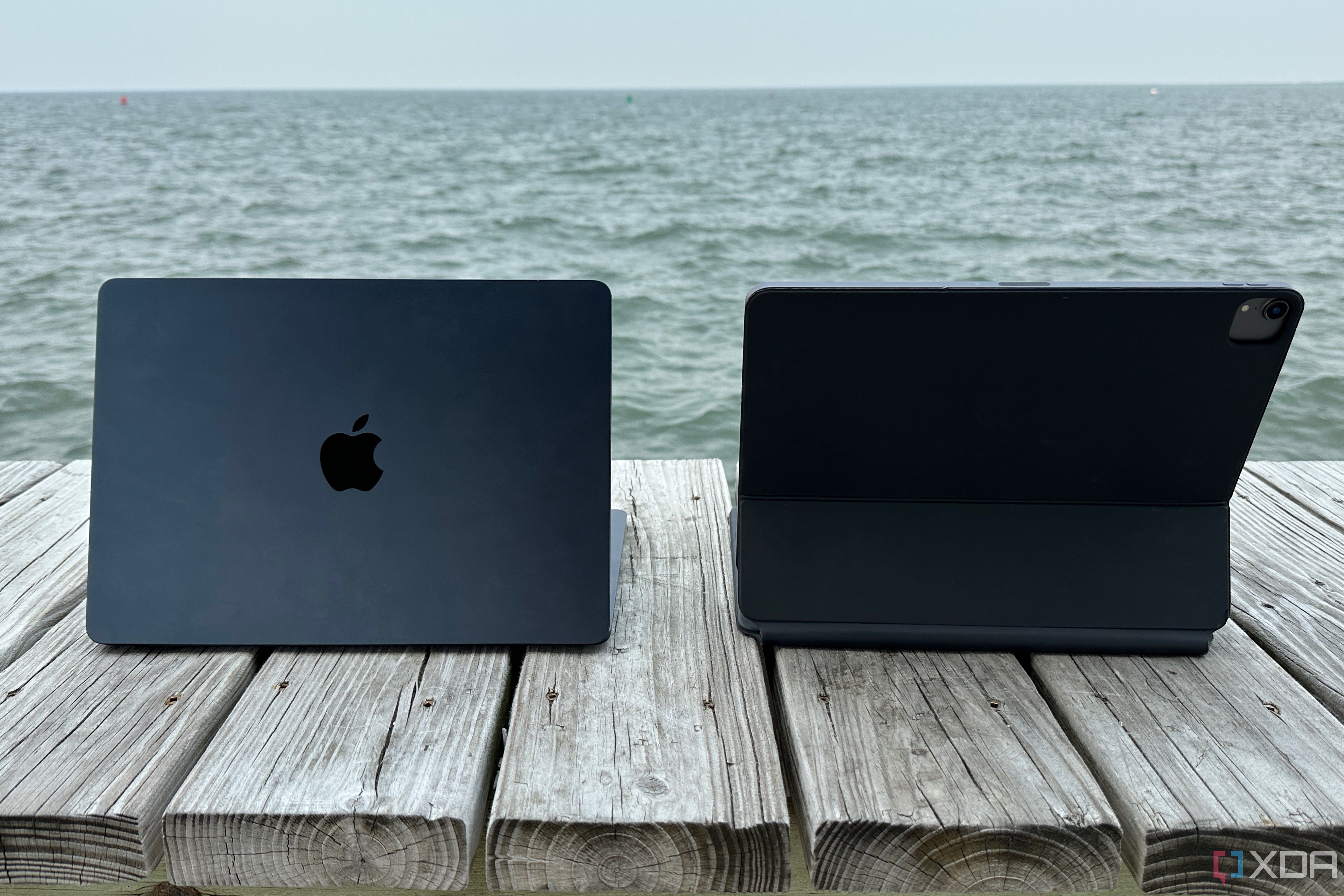An iPad Pro with Magic Keyboard beside a MacBook Air.
