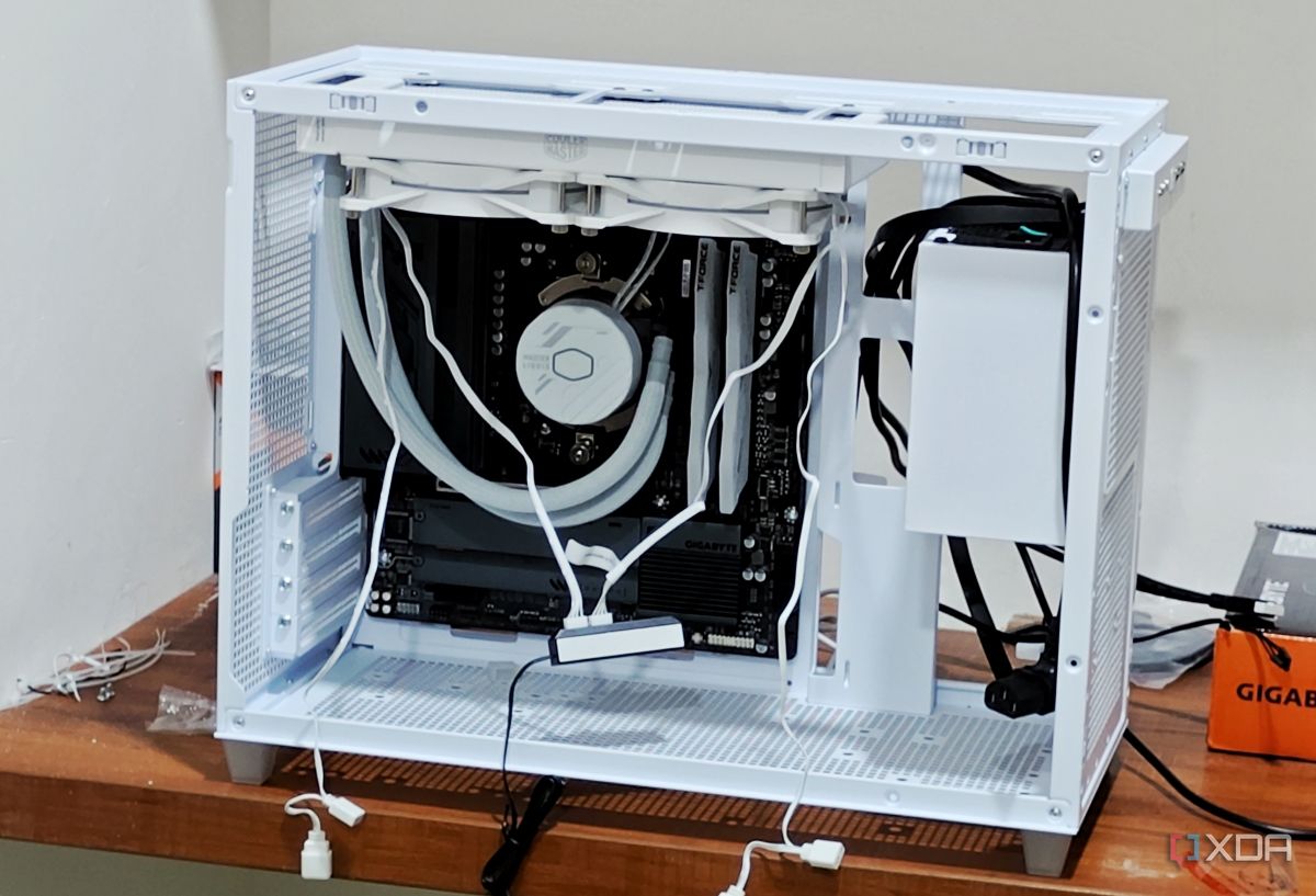 An image showing a half-built PC featuring the Asus Prime AP201 case in white color.