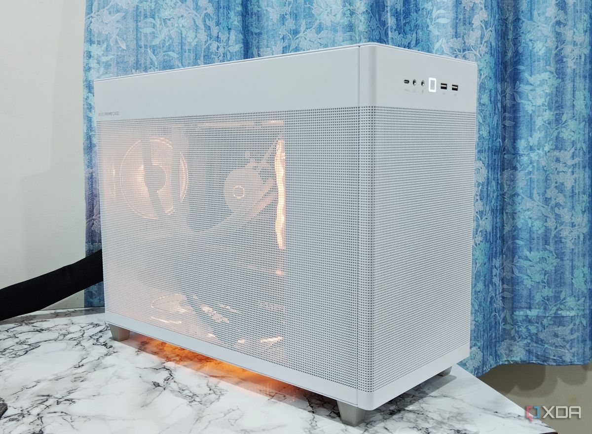 An image showing a white-colored Asus Prime AP201 PC case over a white marble surface.