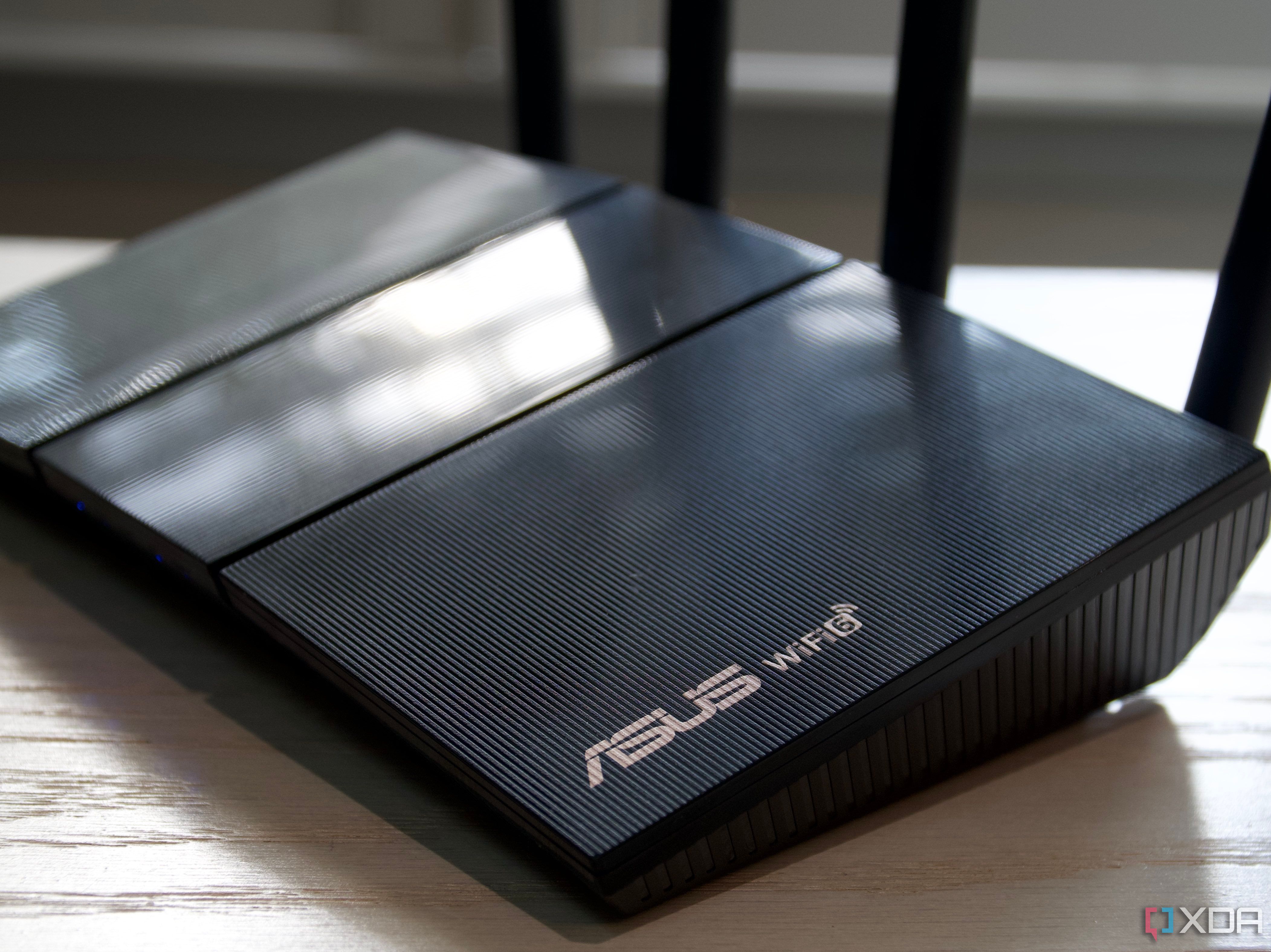 Asus RT-AX57 logo and Wi-Fi 6 marks on the router