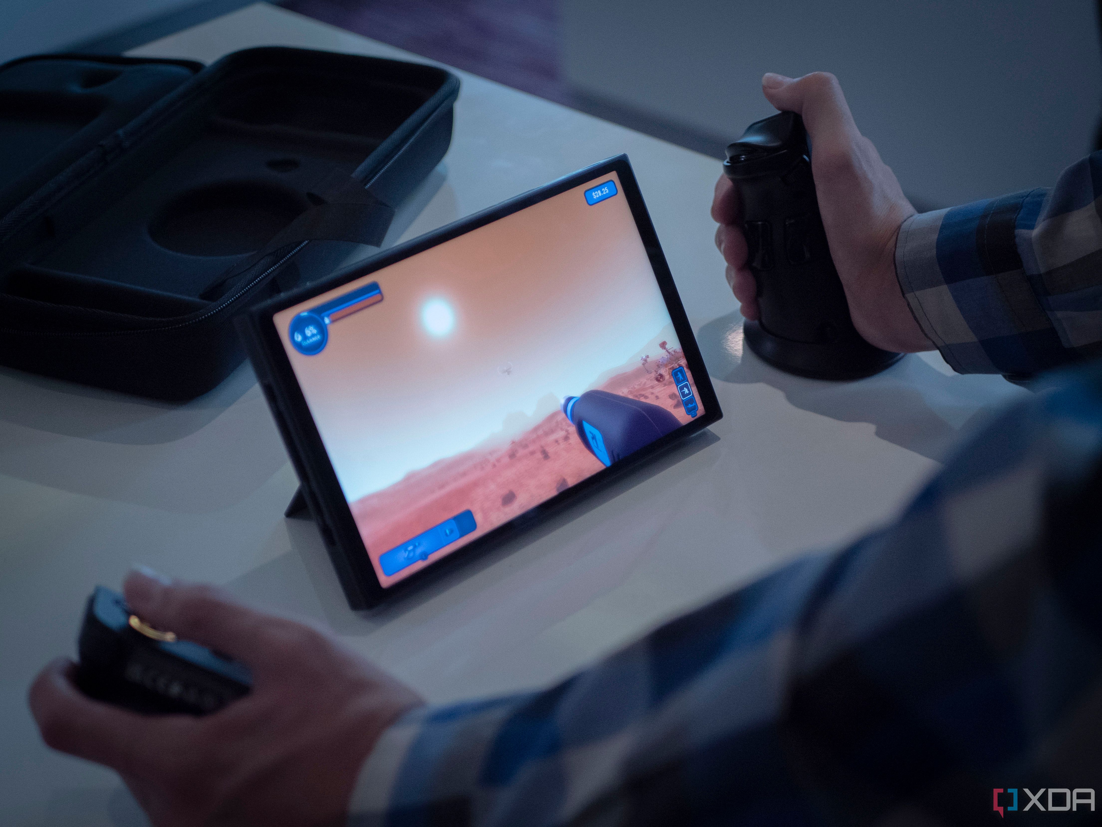 Lenovo Legion Go on a table while being played with detachable controllers