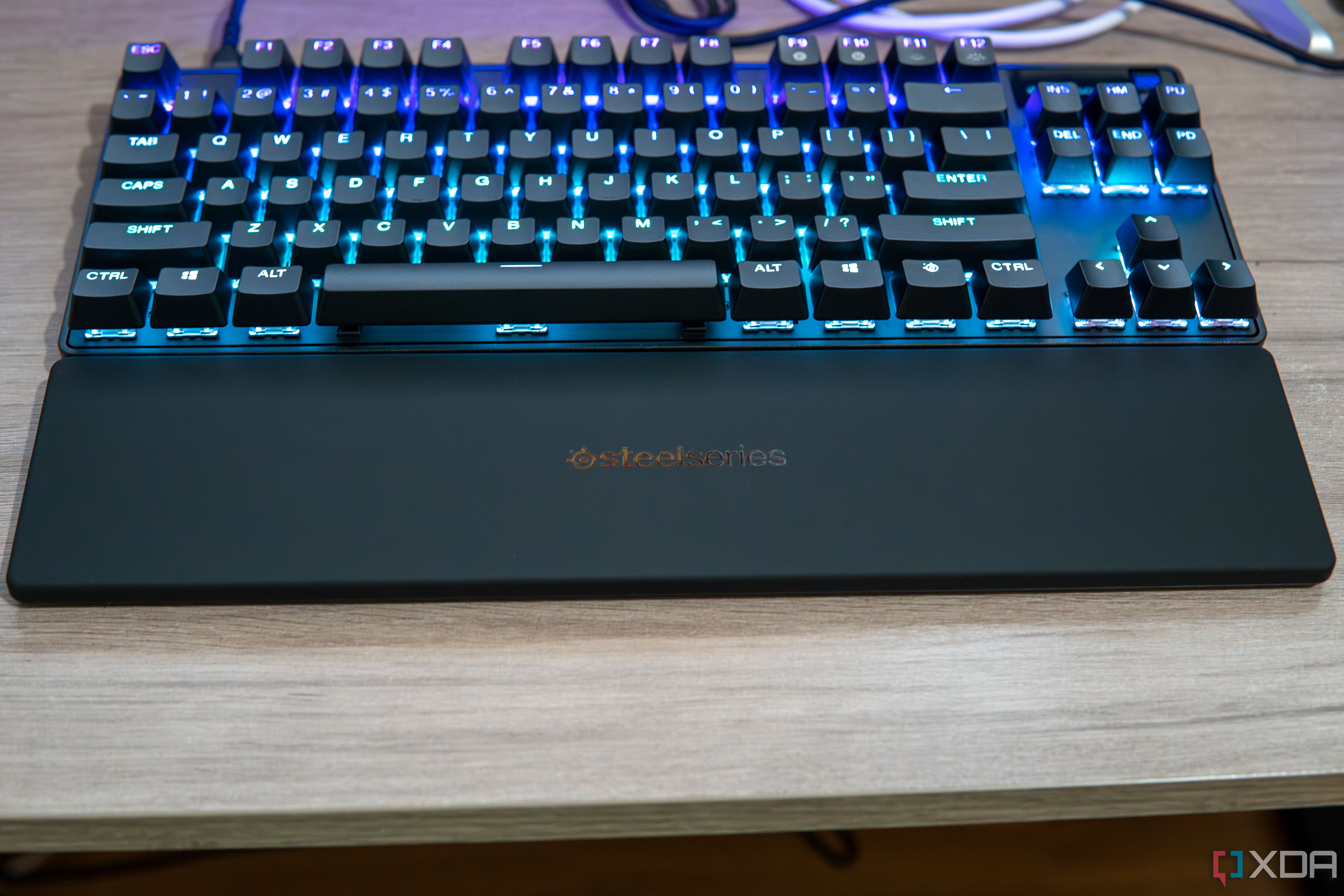 A SteelSeries Apex Pro TKL seen at an angle where the wrist rest is front and center