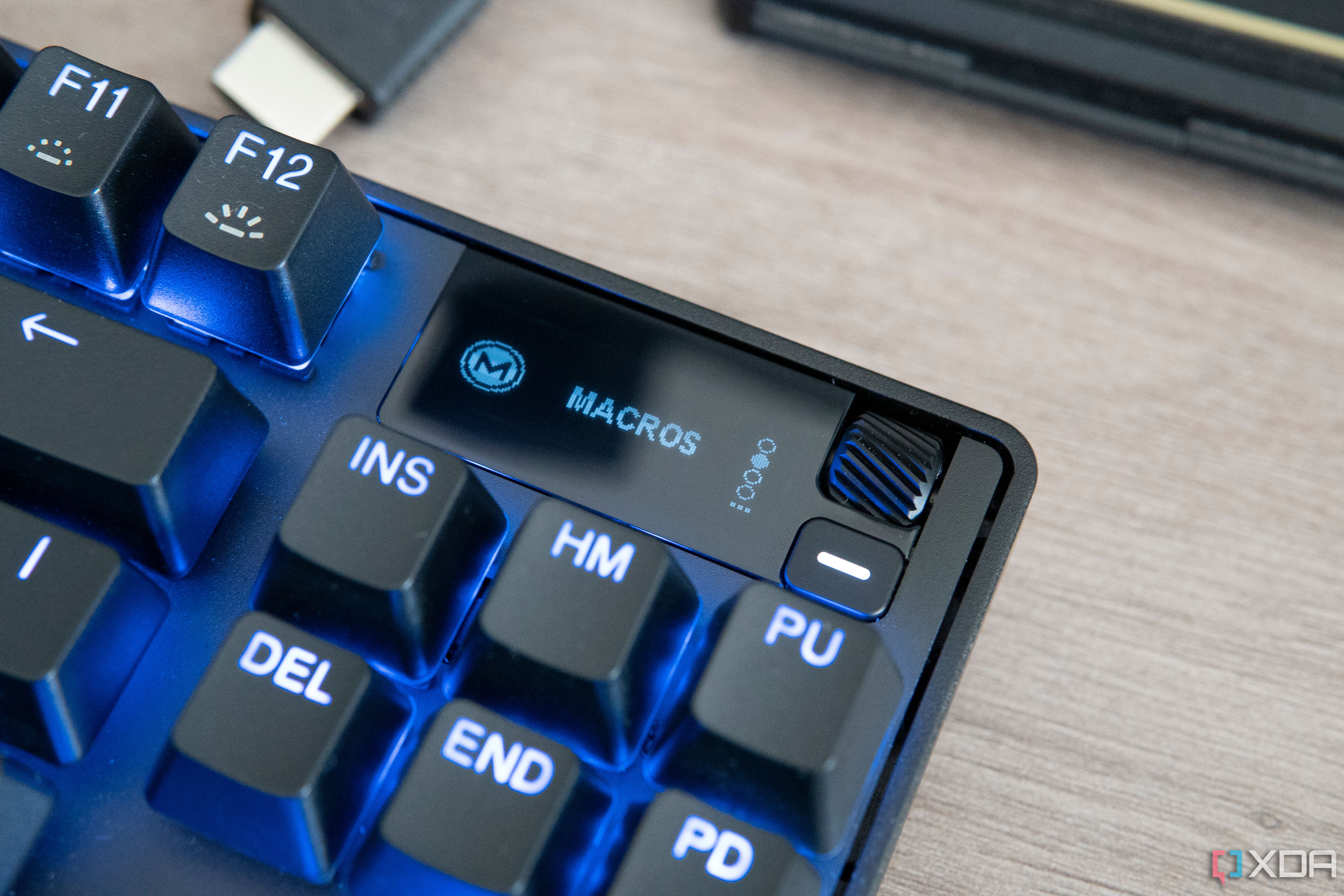 Close-up view of the SteelSeries Apex Pro TKL's OLED display showing the Macros option in the built-in menu