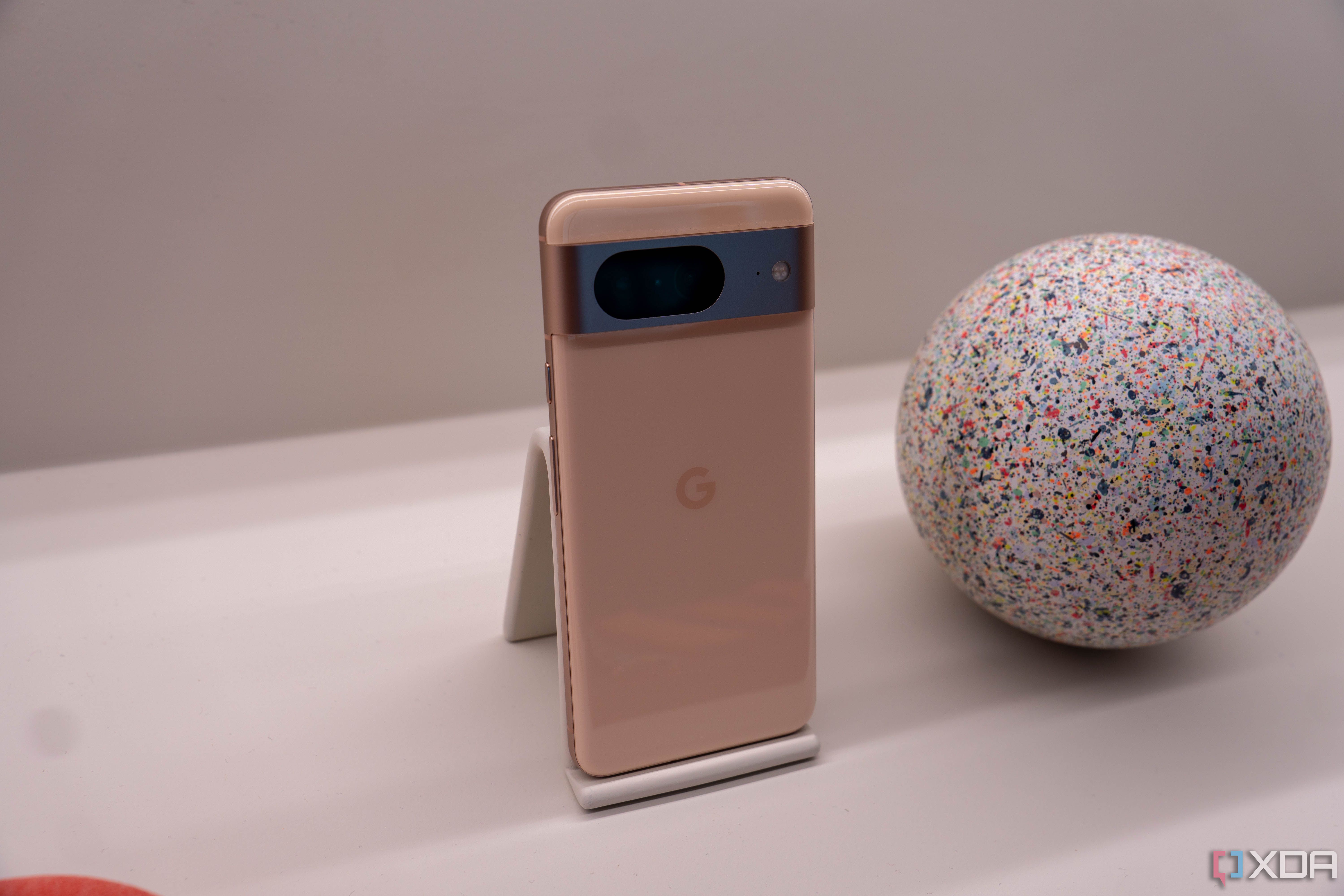 Google Pixel 8 on display next to a ball.
