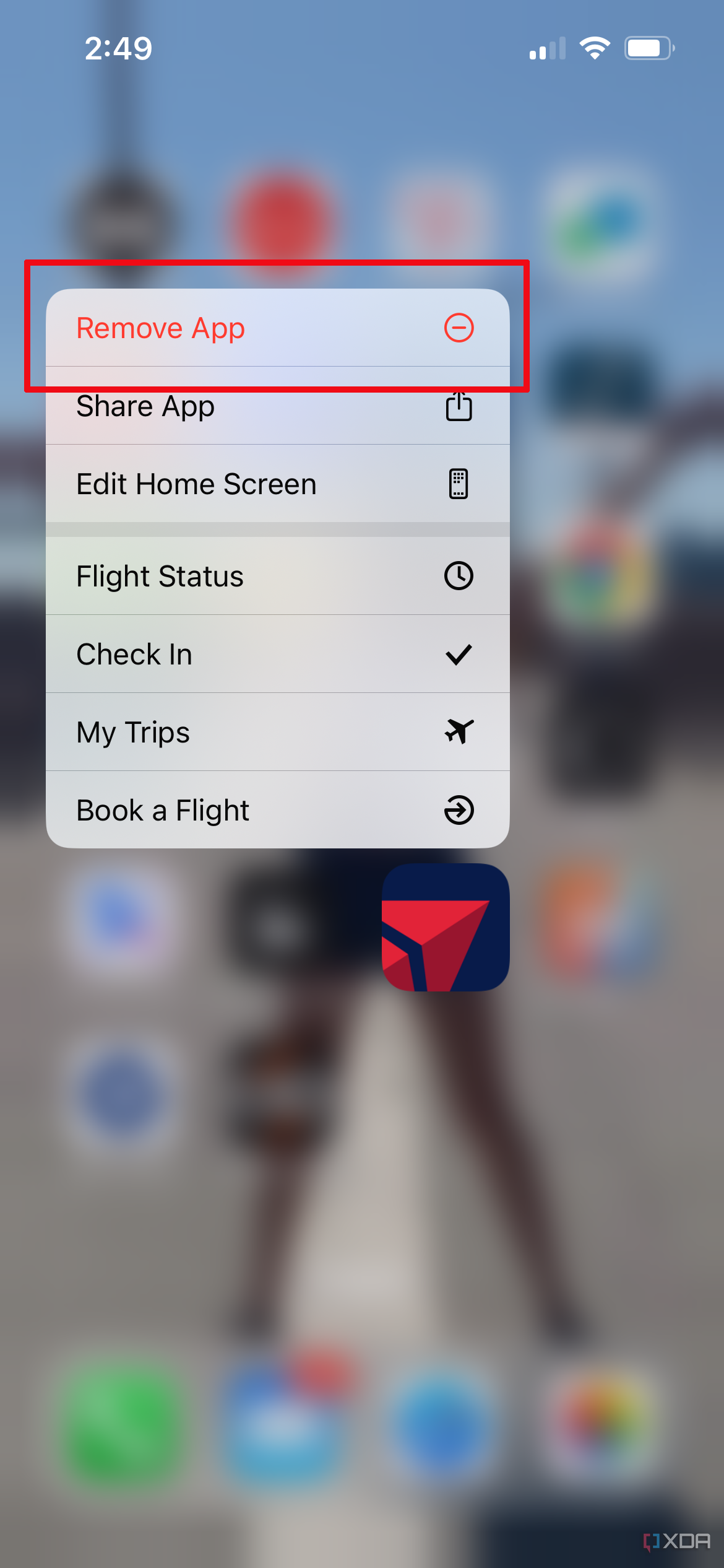 iPhone app screen faded out with Remove app selected in the pop-up menu for the FlyDelta app.