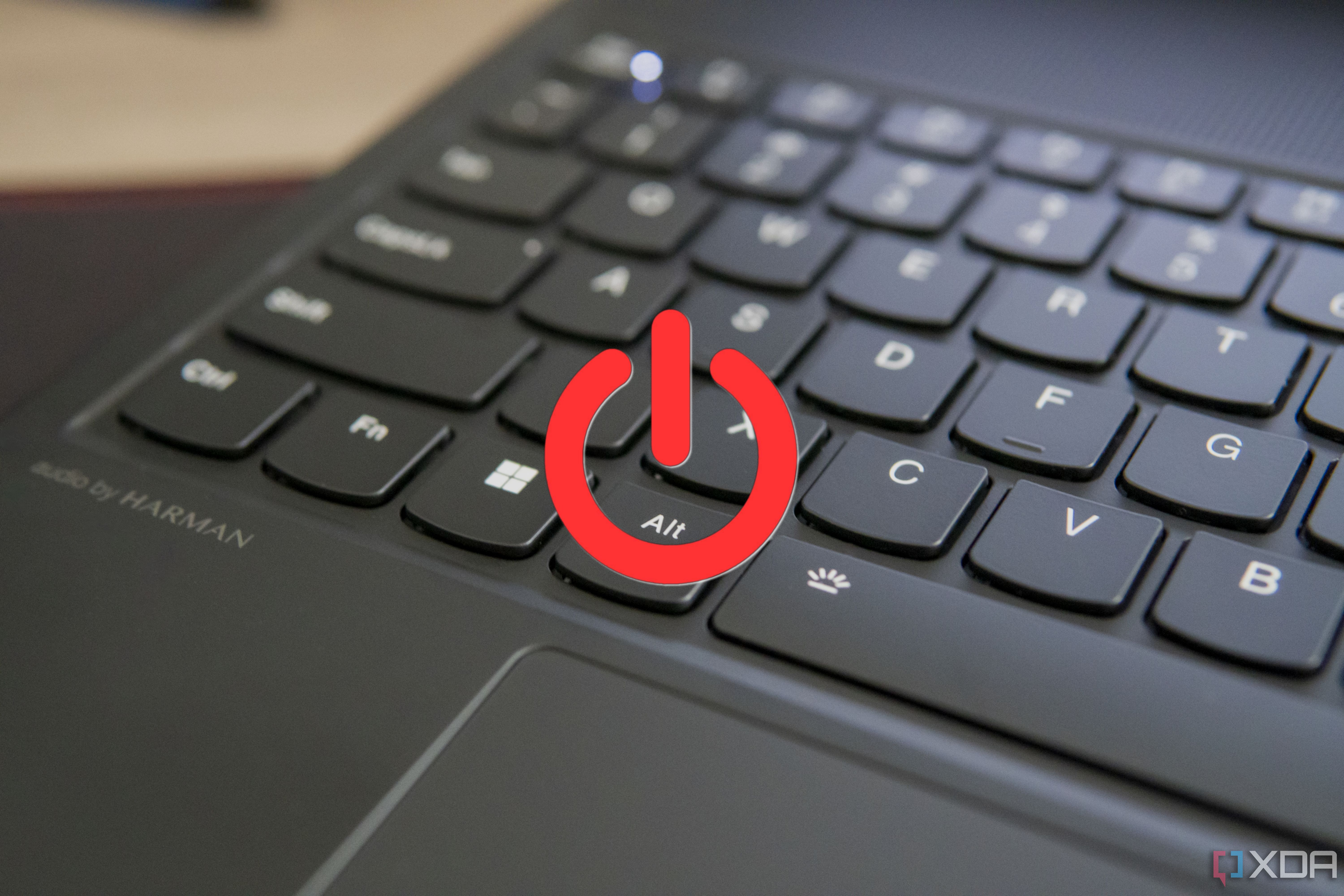 Close-up view of a laptop keyboard with a power icon overlaid on top