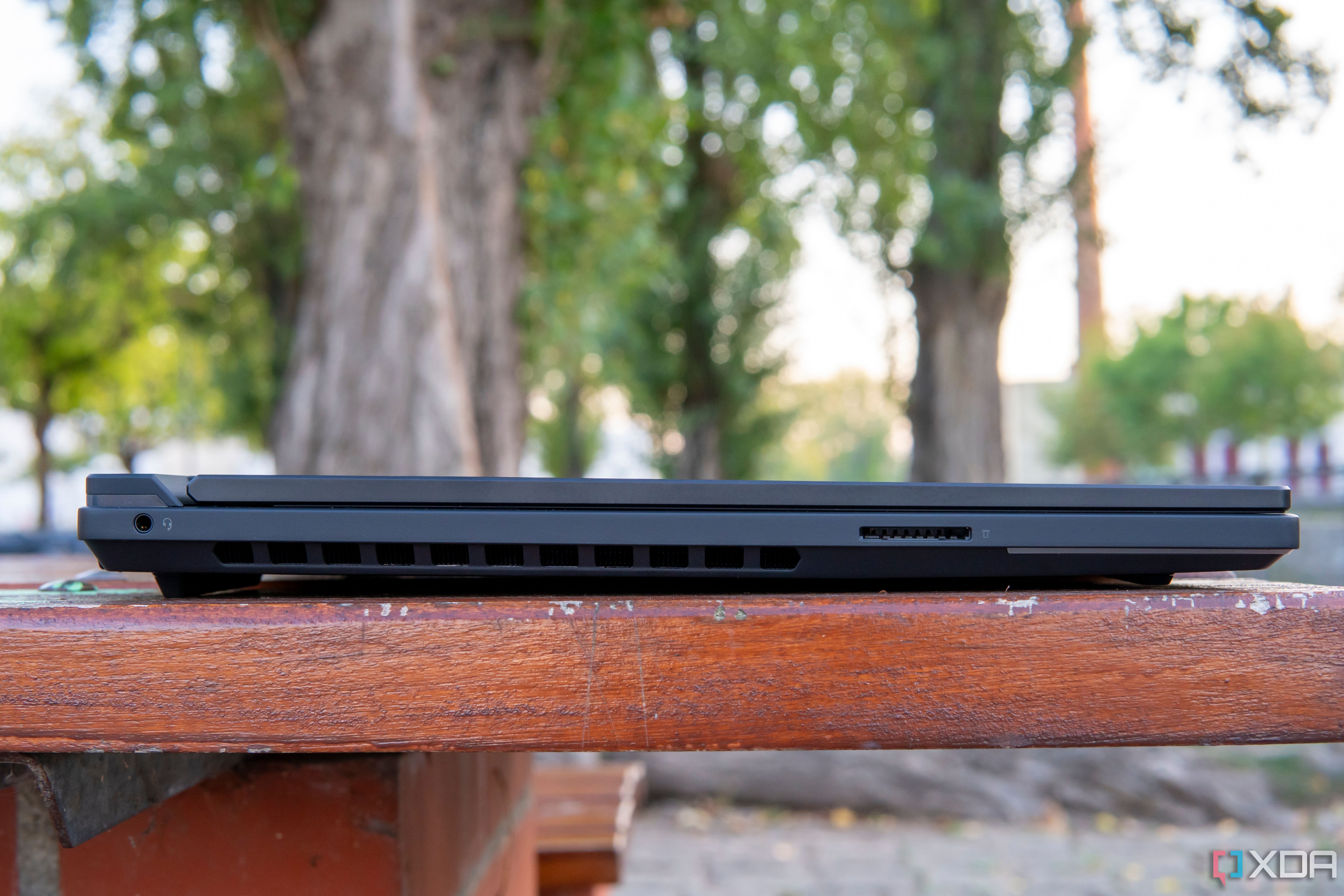 Left-side view of the Lenovo Legion 9i showing a headphone jack and an SD card reader