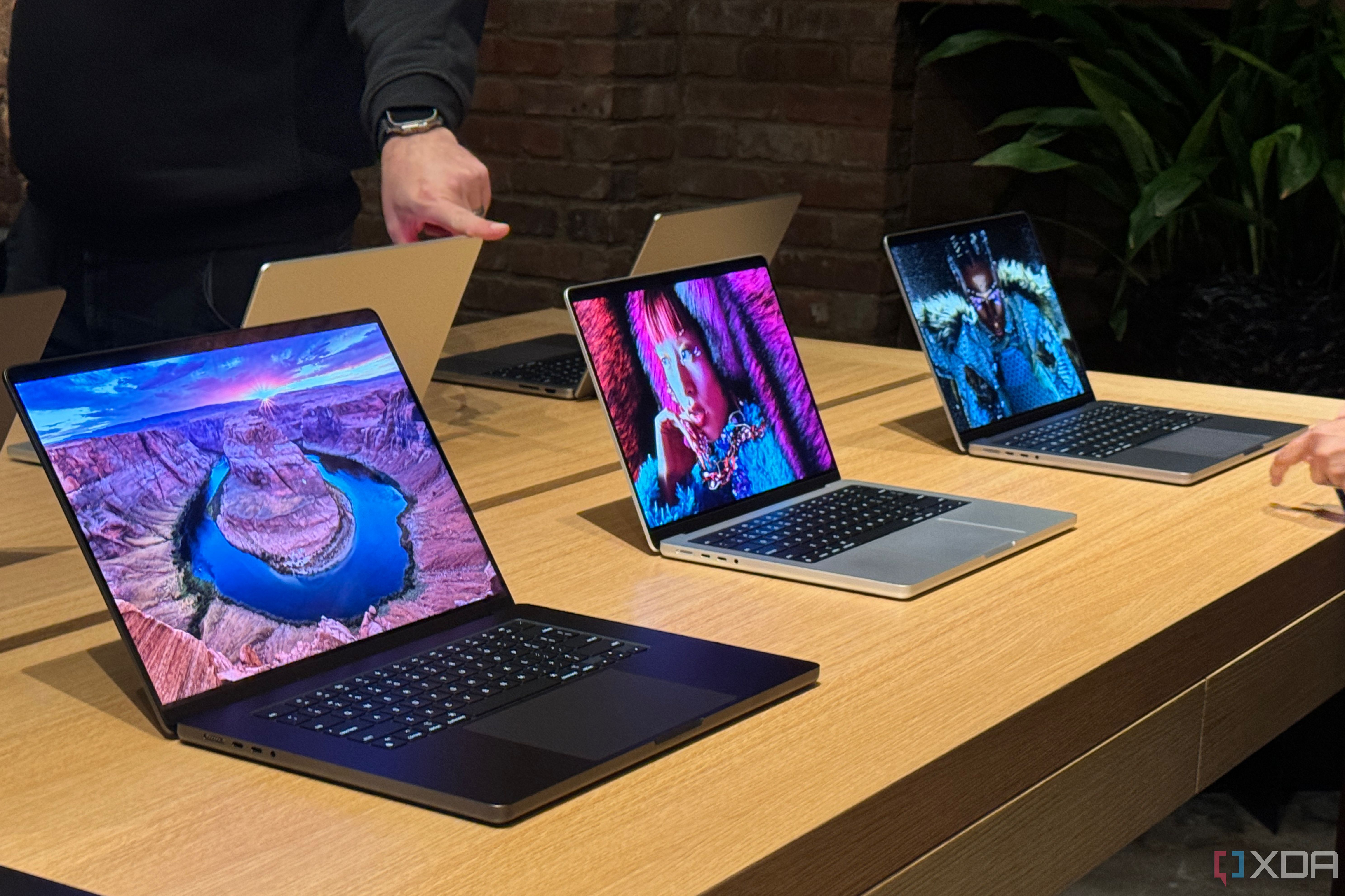 The M3 MacBook Pro lineup on a table.