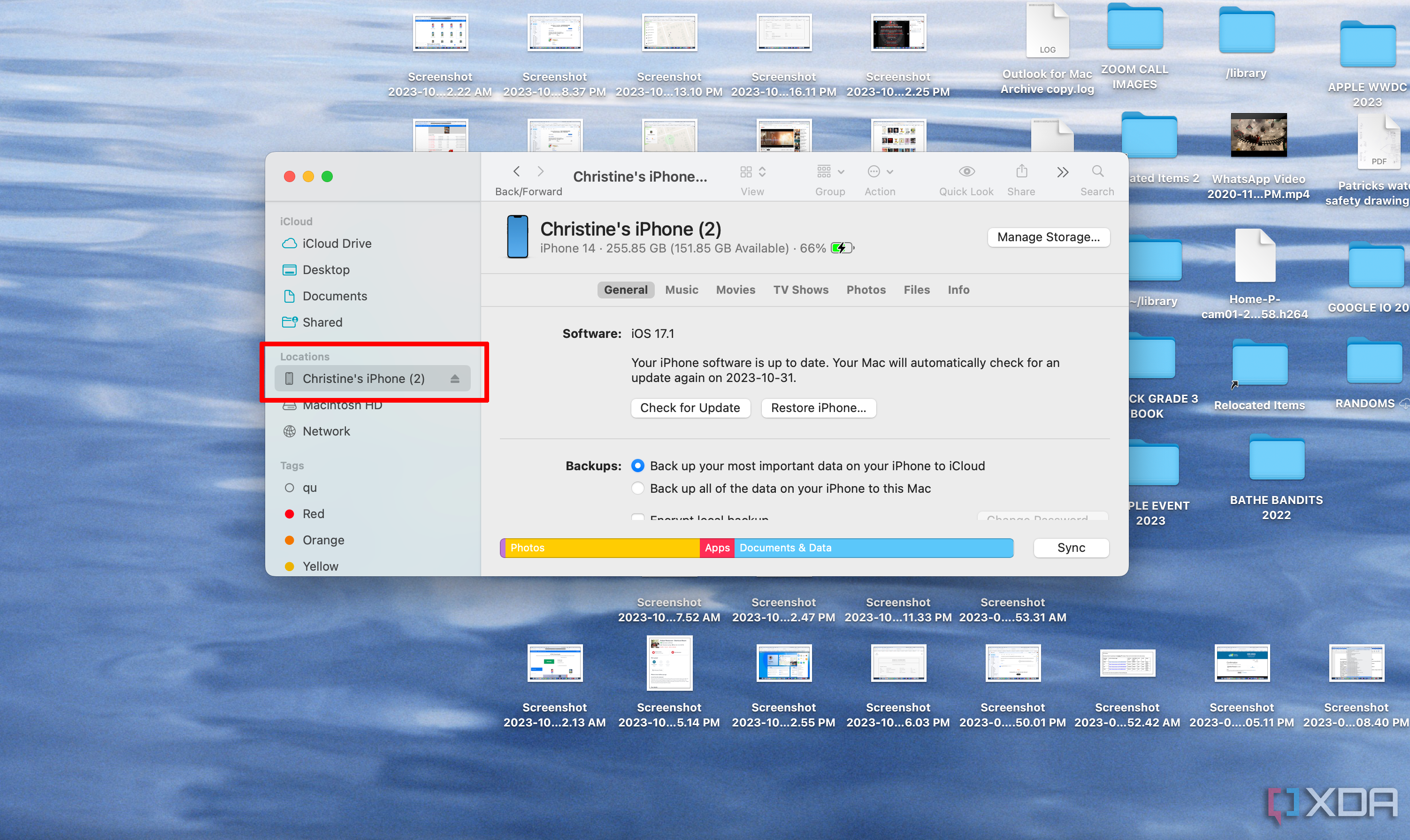 A finder Window showing an iPhone, software version, storage, and more.