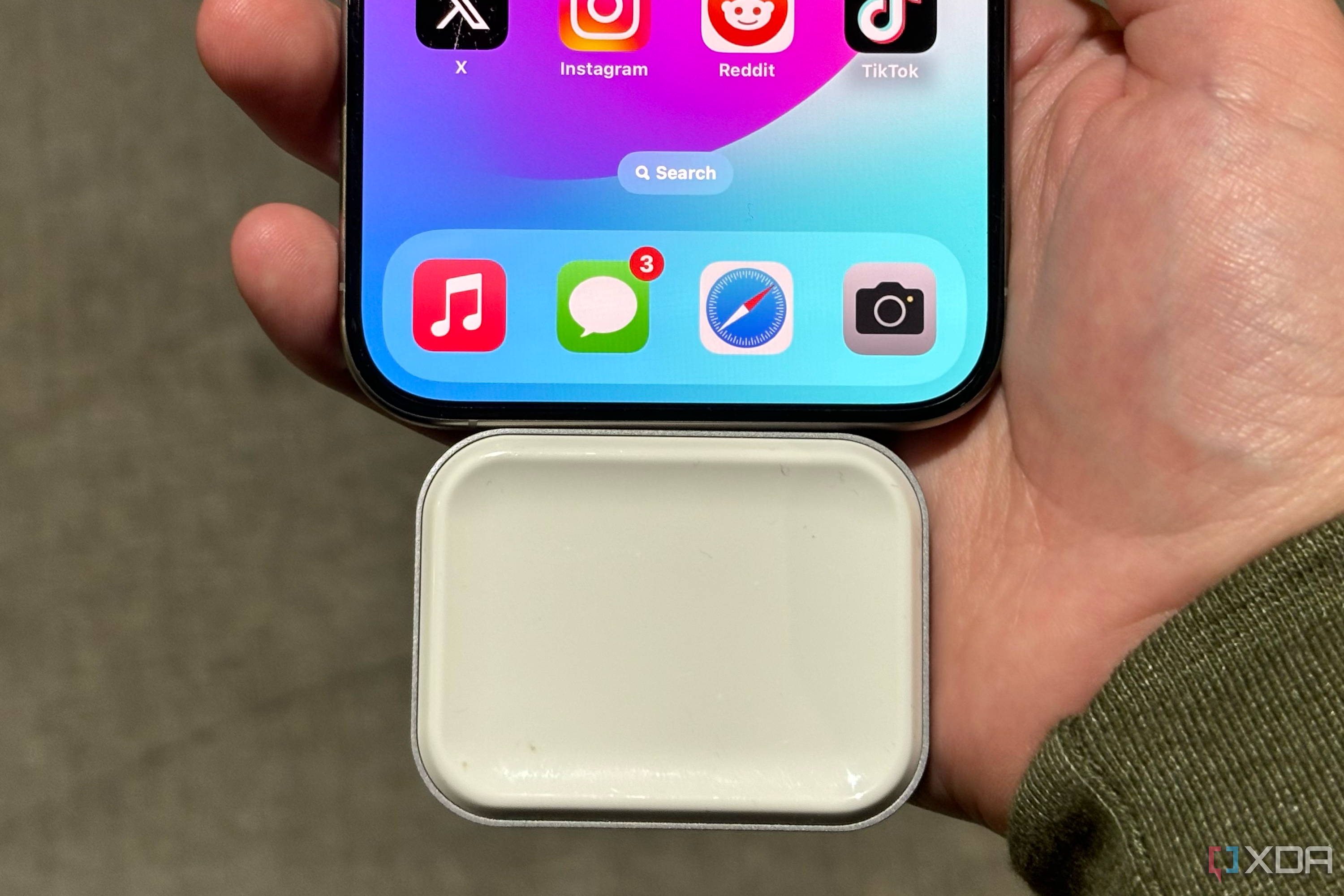 An AirPods wireless charging dongle from Satechi.