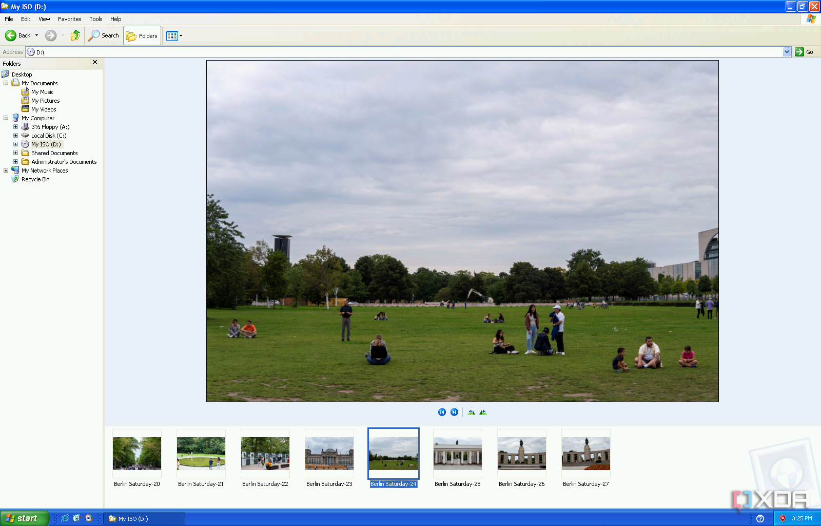 Снимок экрана Проводника Windows в Windows XP, показывающий предварительный просмотр большого изображения и диафильм внизу.