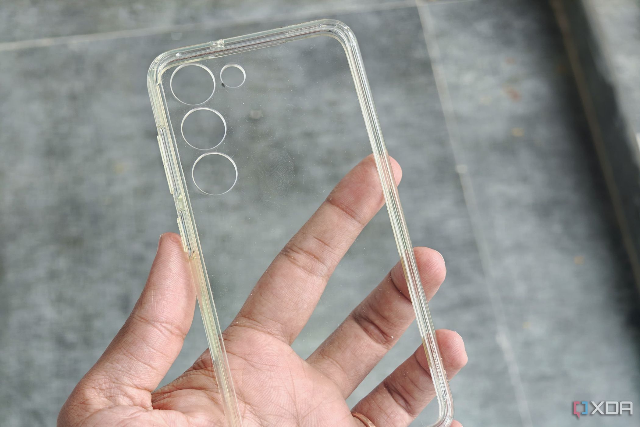 A clear case shown with a bunch of greasy fingerprints on it.