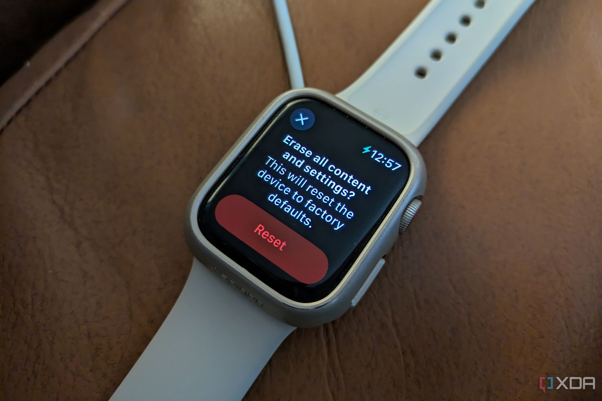 An Apple Watch on its charging showing the reset option.