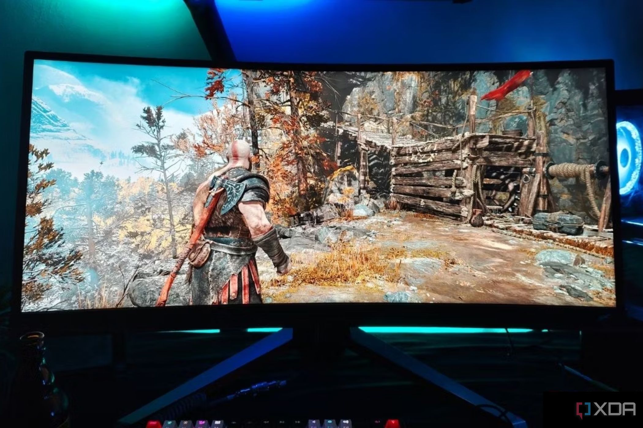 An image showing a Benq Mobiuz ex3415r ultrawide monitor displaying God Of War gameplay.