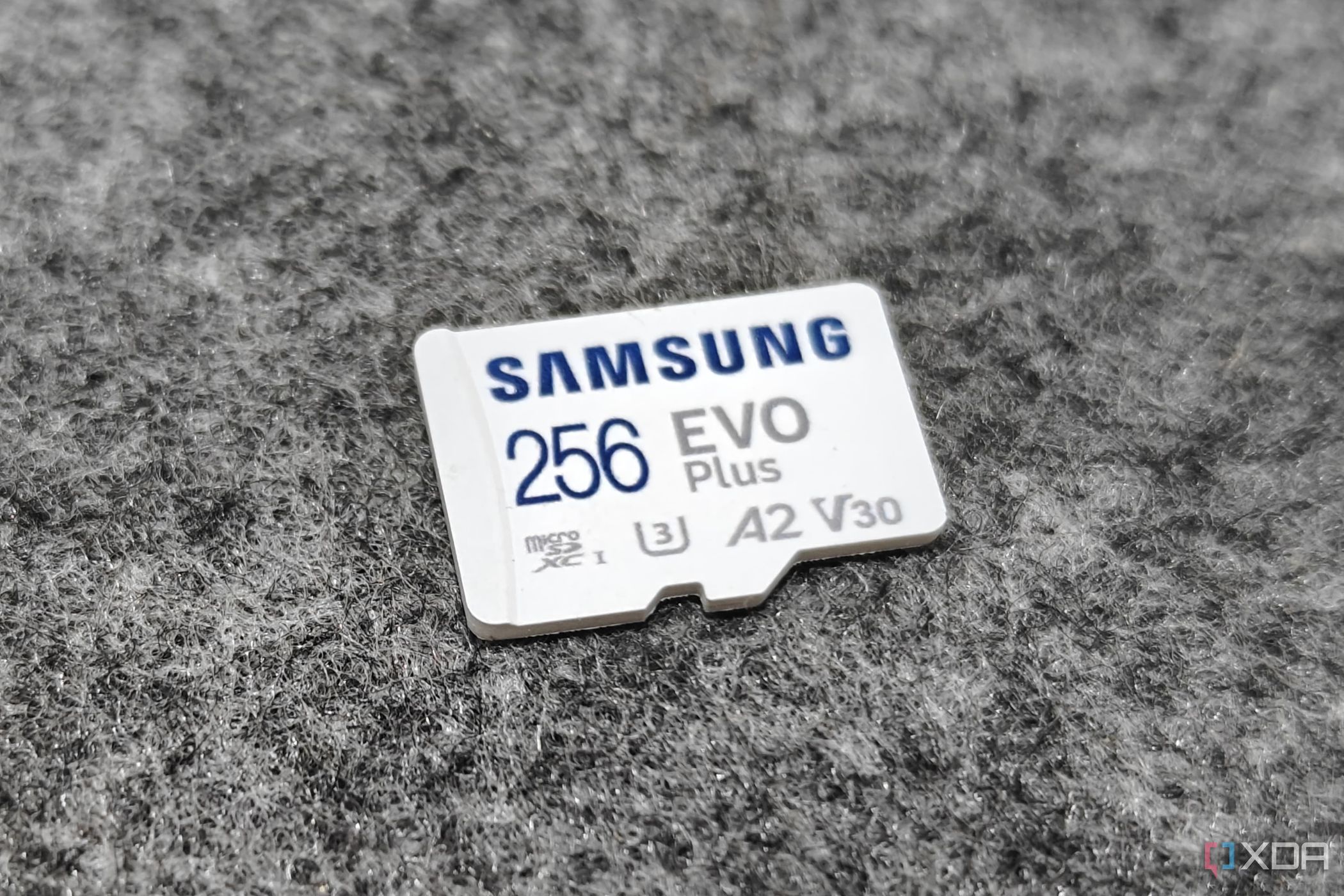 An image showing the front side of a microsd card kept on a felt pad.