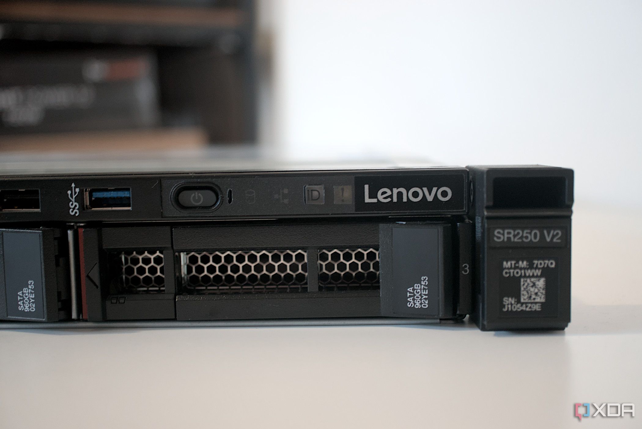 Lenovo ThinkSystem SR250 V2 set on a table with blurred background