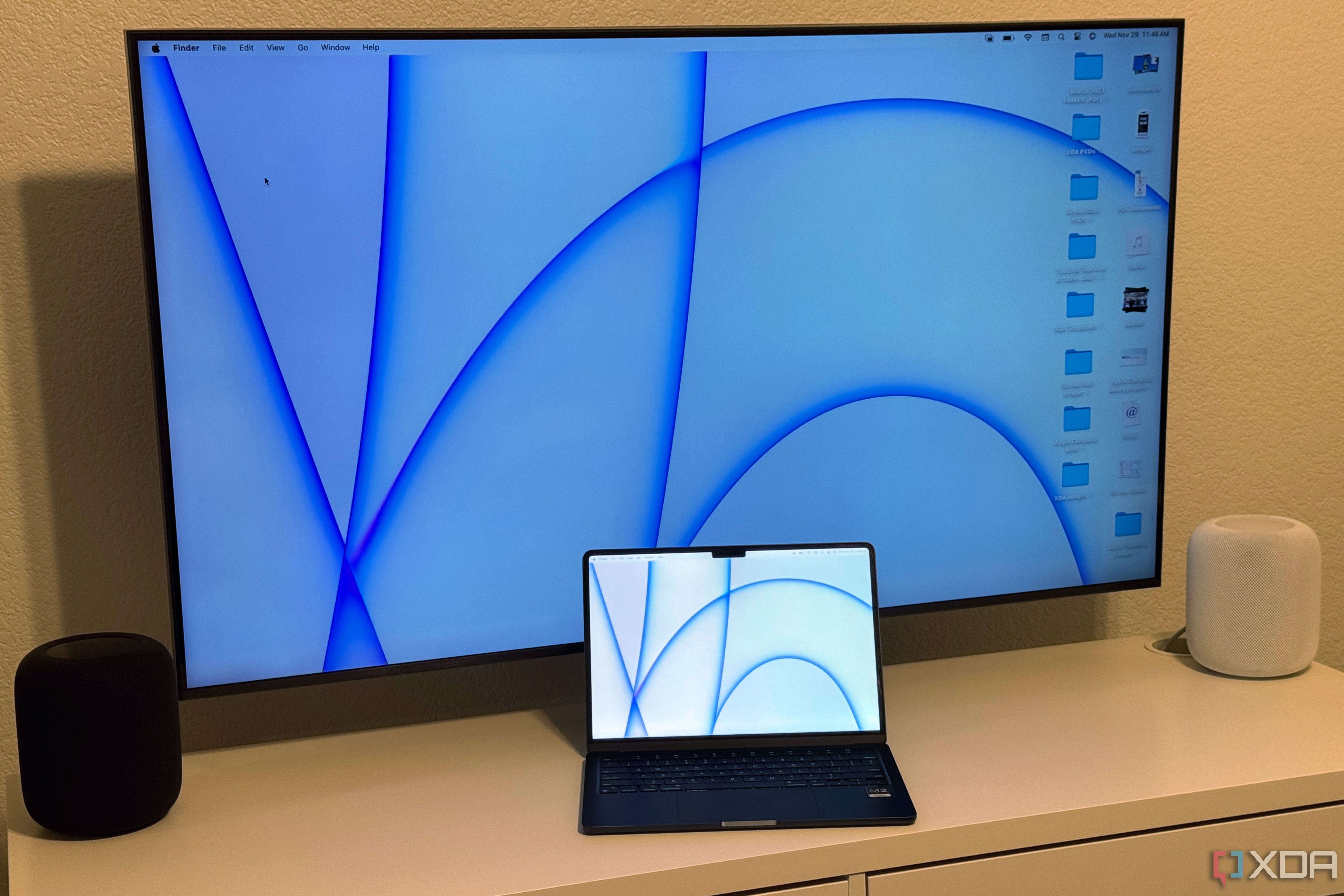 Two Mac desktop screens on a MacBook Air and Apple TV.