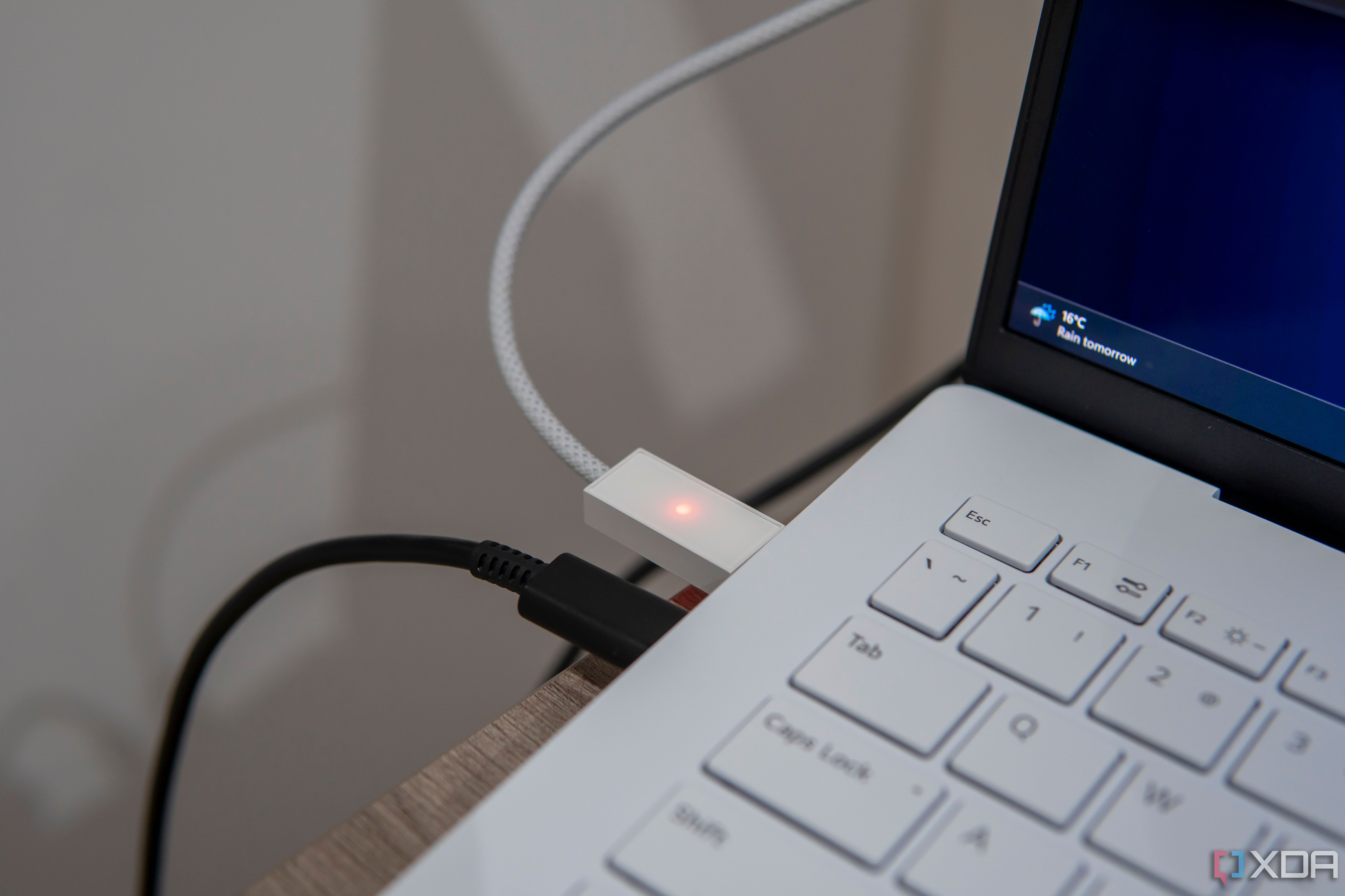 Close-up view of the USB connector on the Opal Tadpole with a red light indicating that the microphone is muted