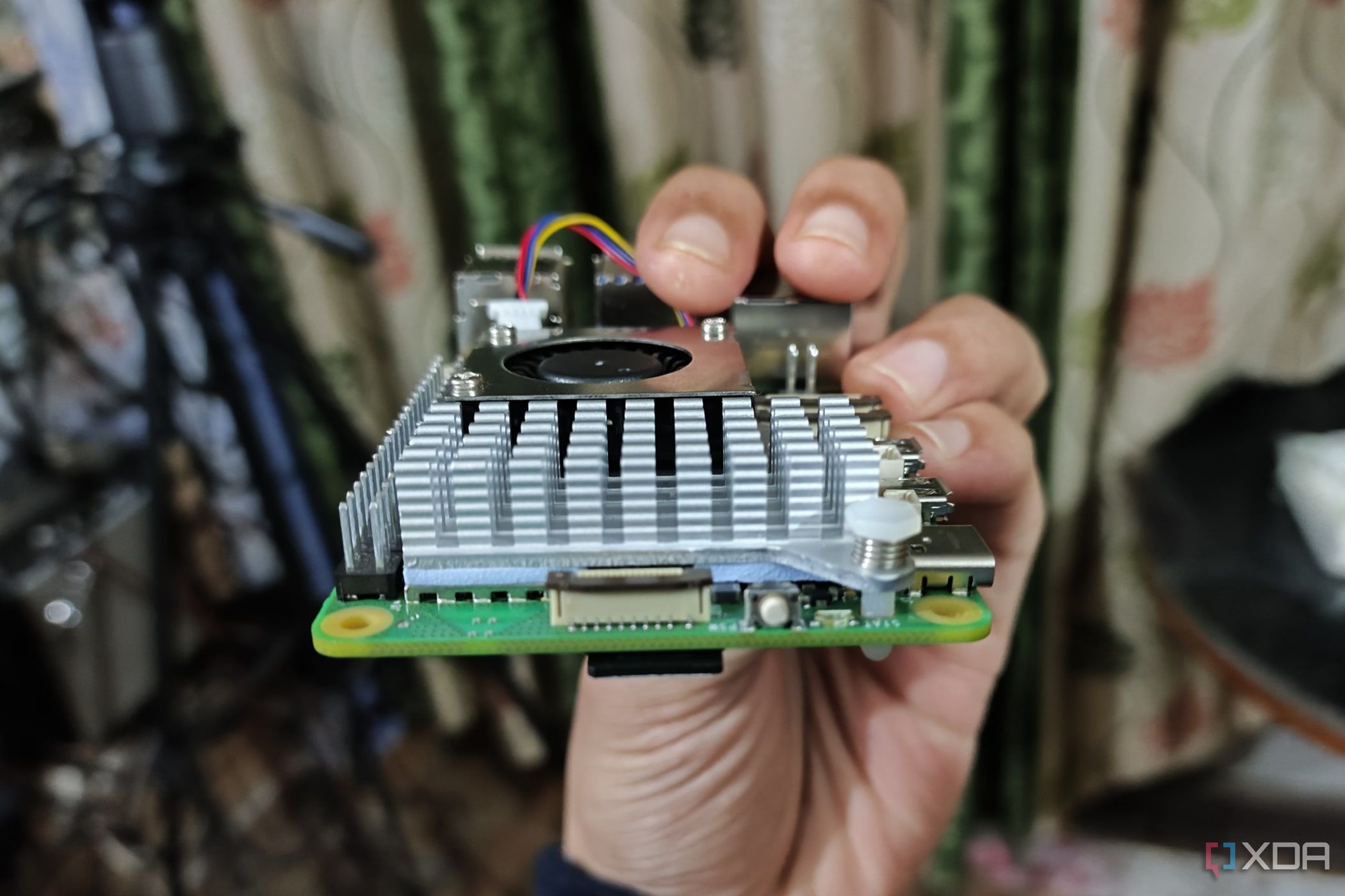 An image of the Raspberry Pi 5 with the power button and PCIe interface visible