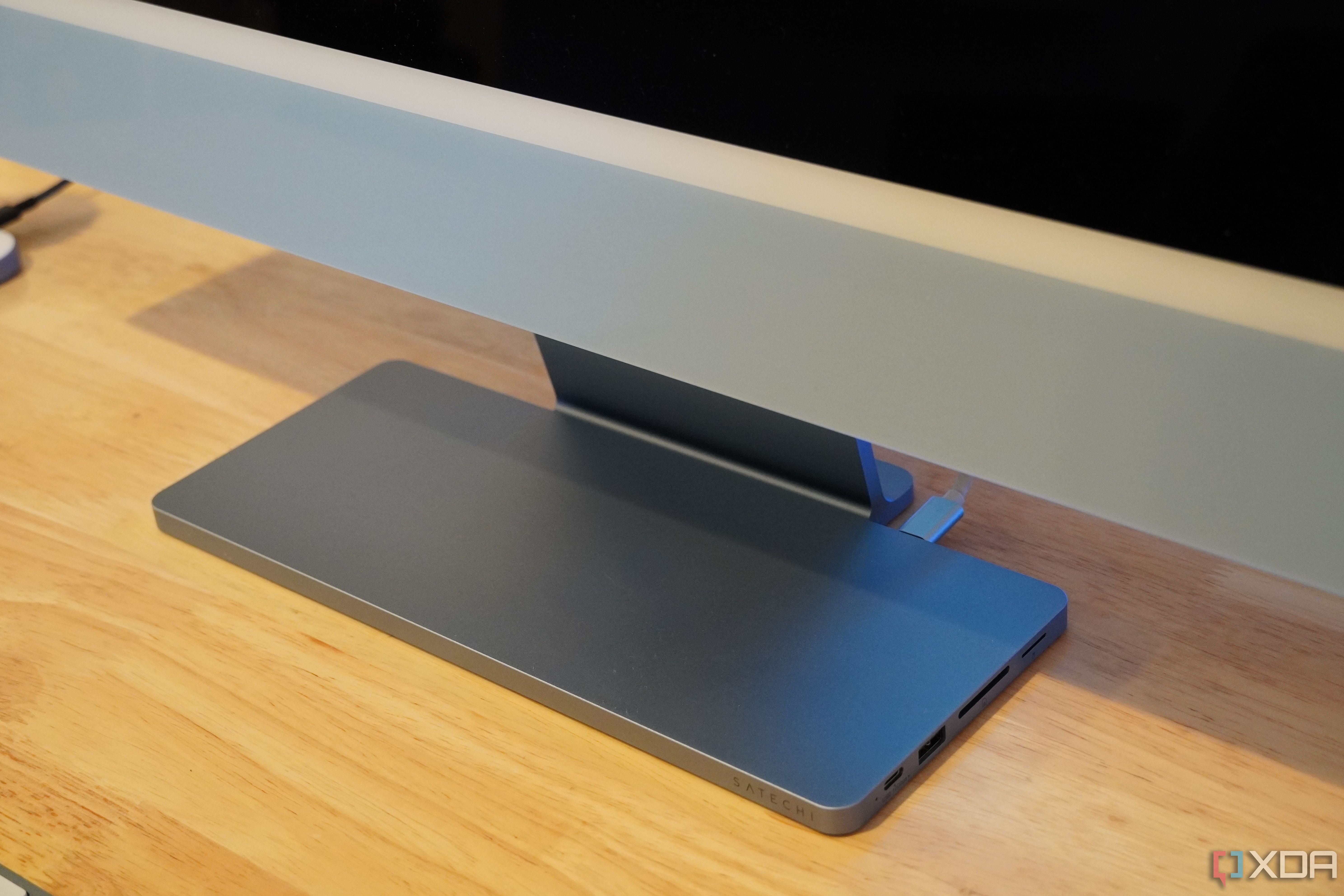 The Satechi USB-C Slim Dock at the base of a 24-inch iMac.