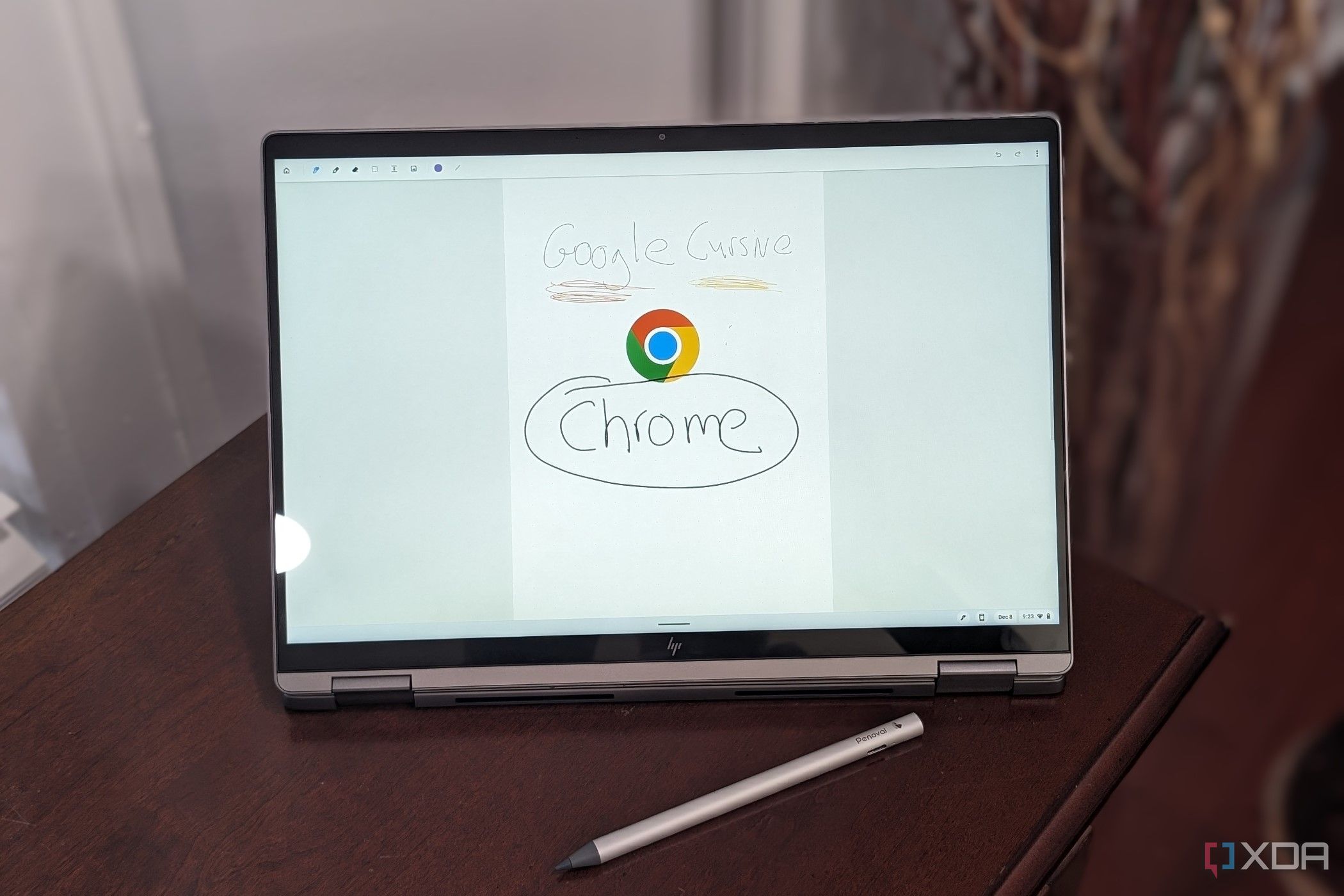 The display on the HP Chromebook Plus x360 Laptop 14ct showing the Chrome Logo with a USI pen in theforeground