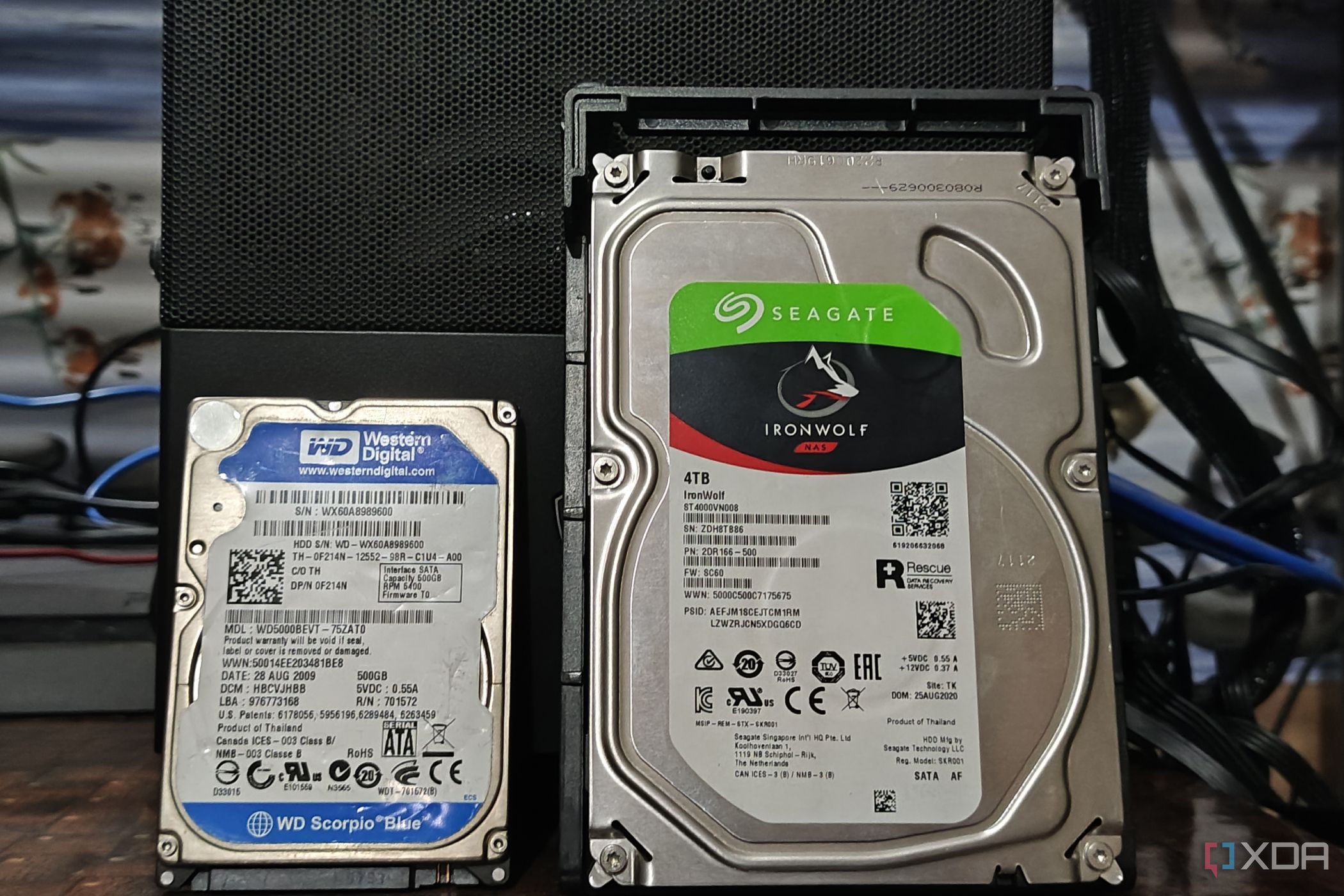 A Seagate IronWolf NAS 4TB hard drive kept next to a WD Blue 500GB hard drive