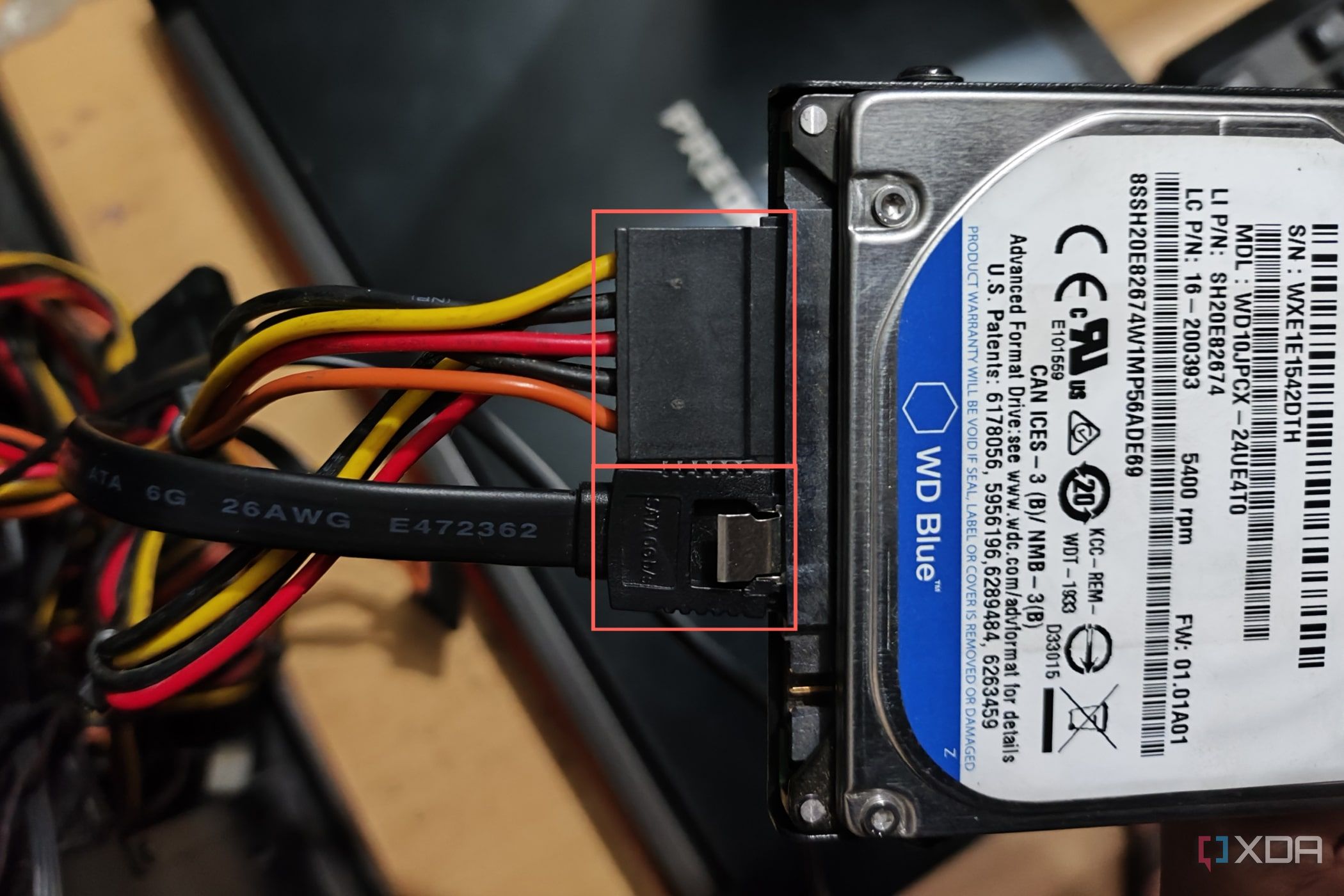 An image of SATA data and power cables plugged into a WD 500GB HDD