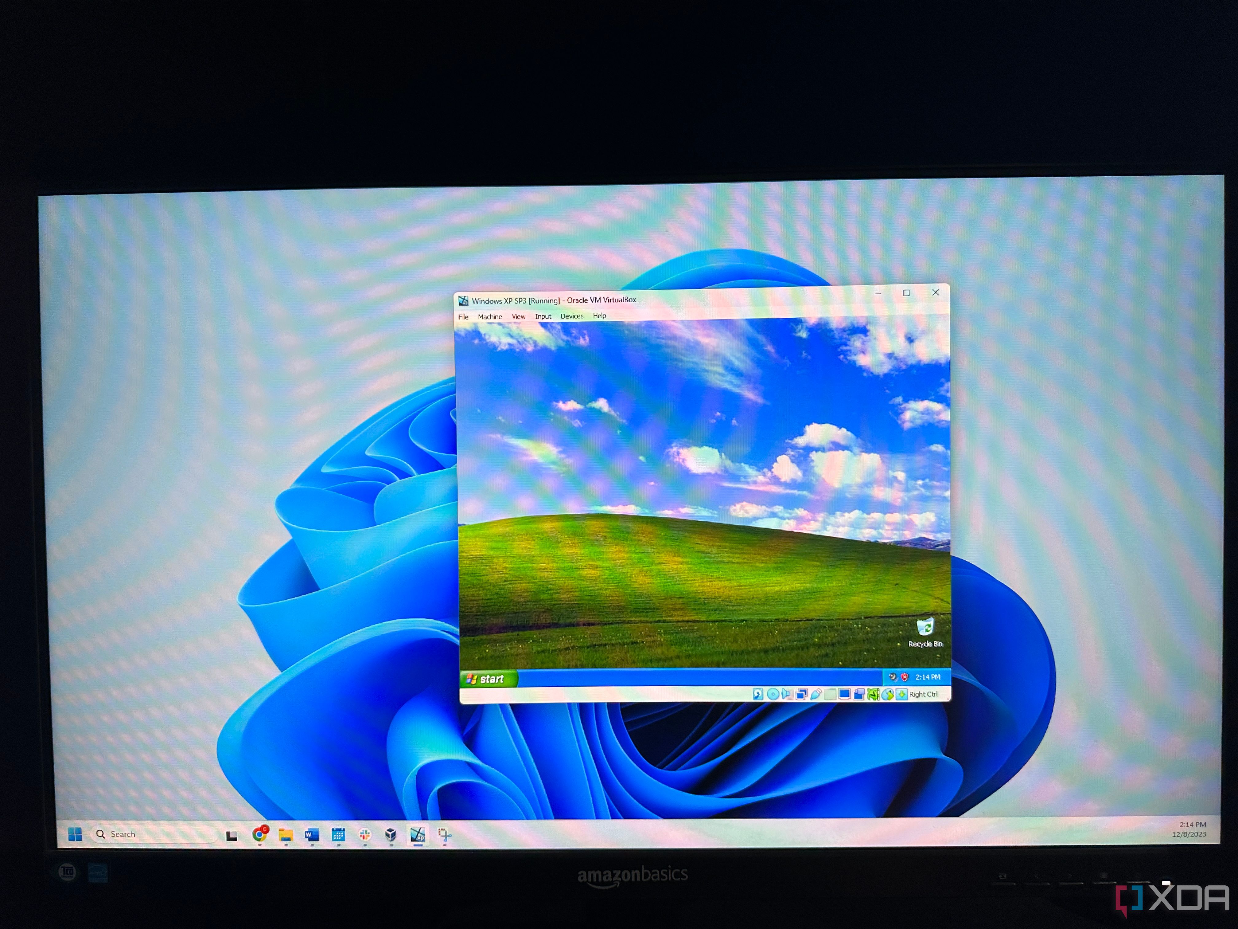 Monitor of a computer running Windows 11 with VirtualBox open running Windows XP