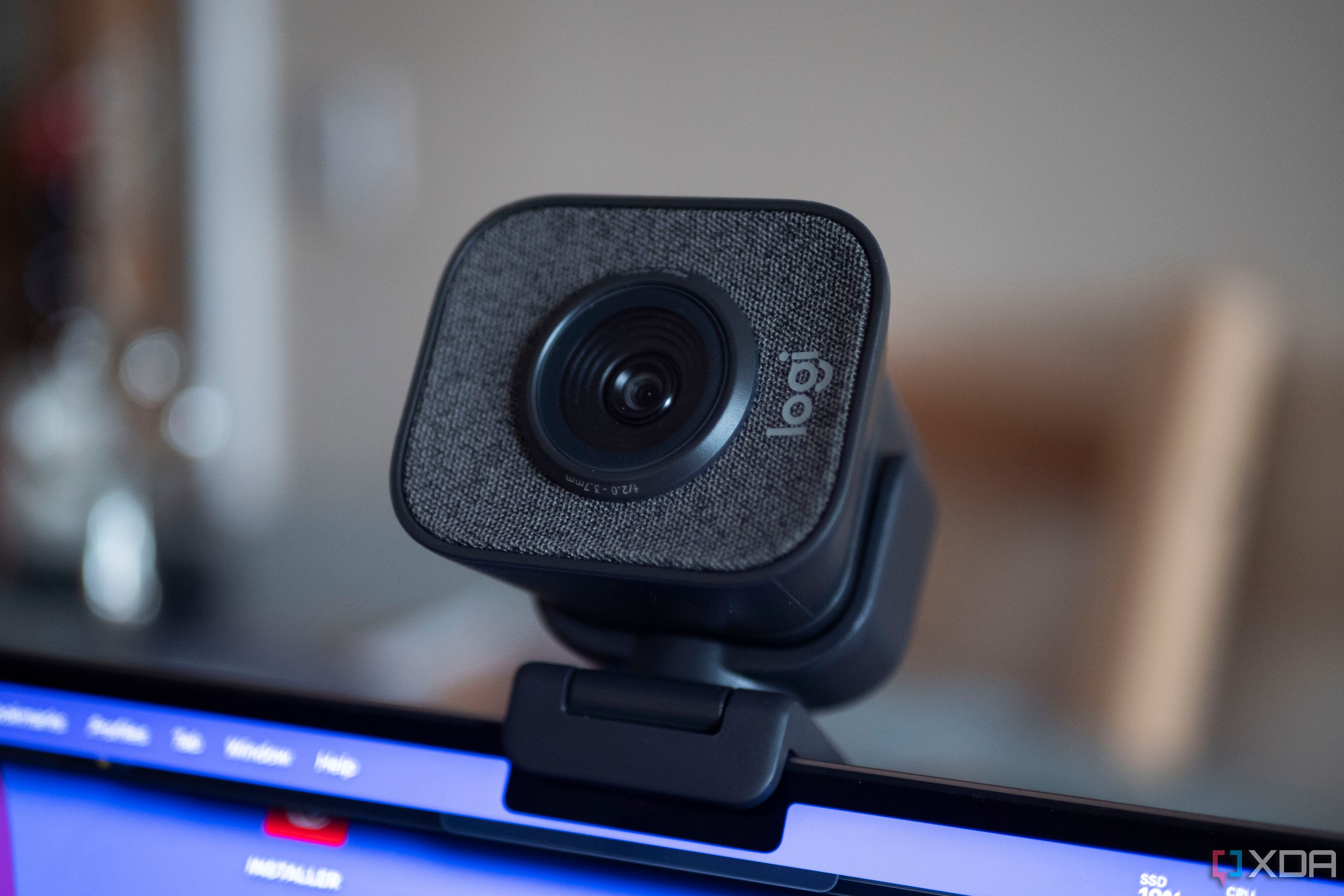 Logitech StreamCam on top of a laptop, facing the camera at an angle