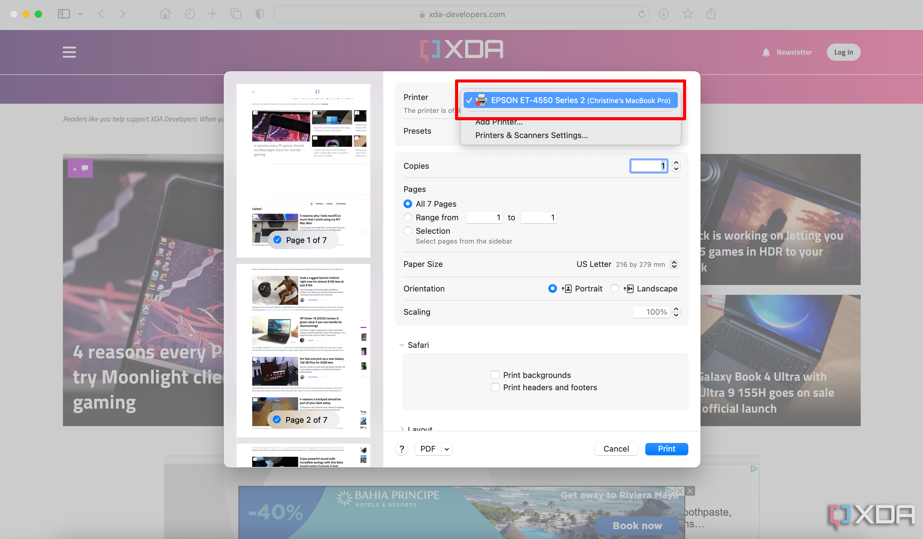 Una ventana de impresión abierta en una Mac, el sitio web XDA en segundo plano, con el modelo de impresora seleccionado.