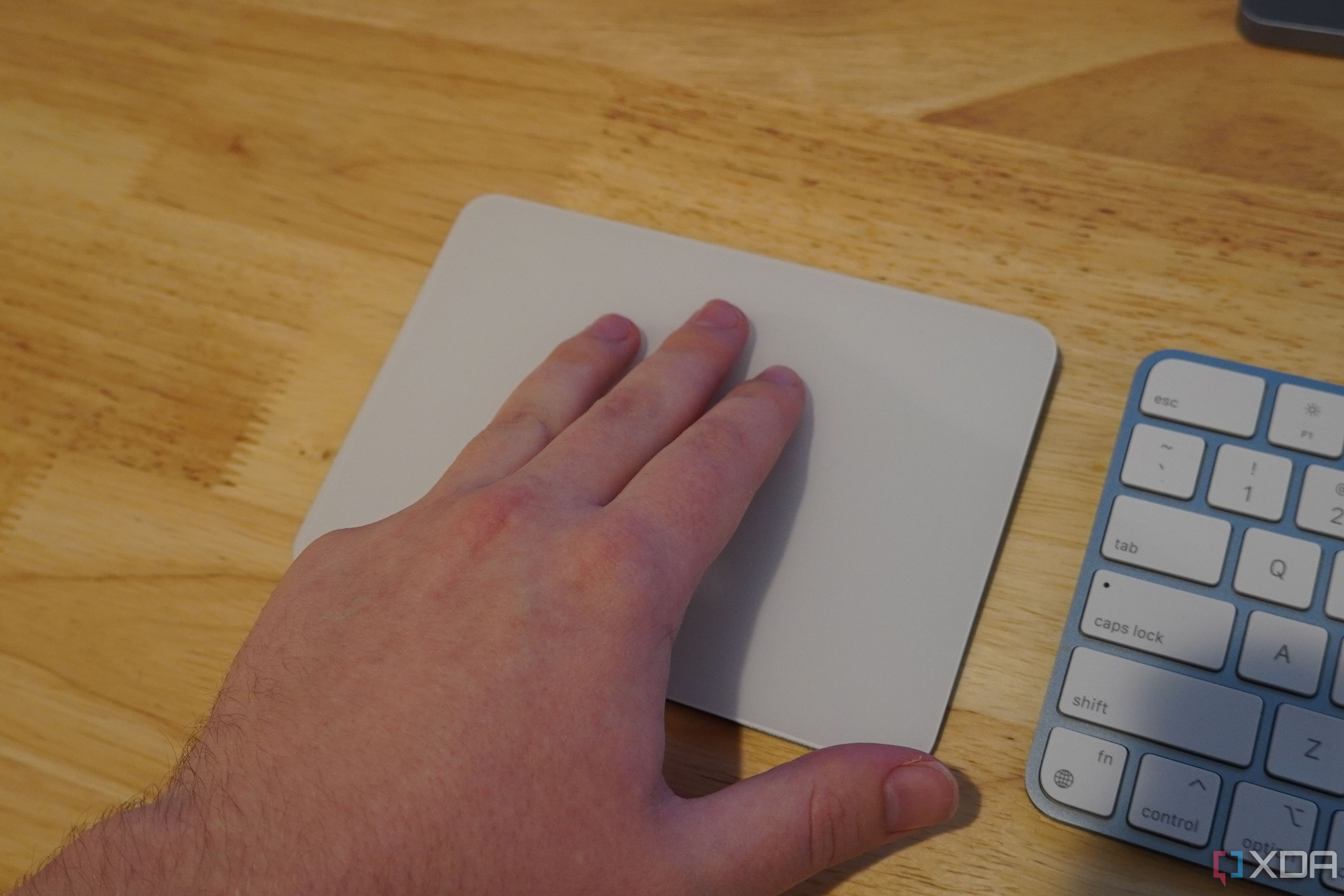 A three-finger swipe on a Magic Trackpad.