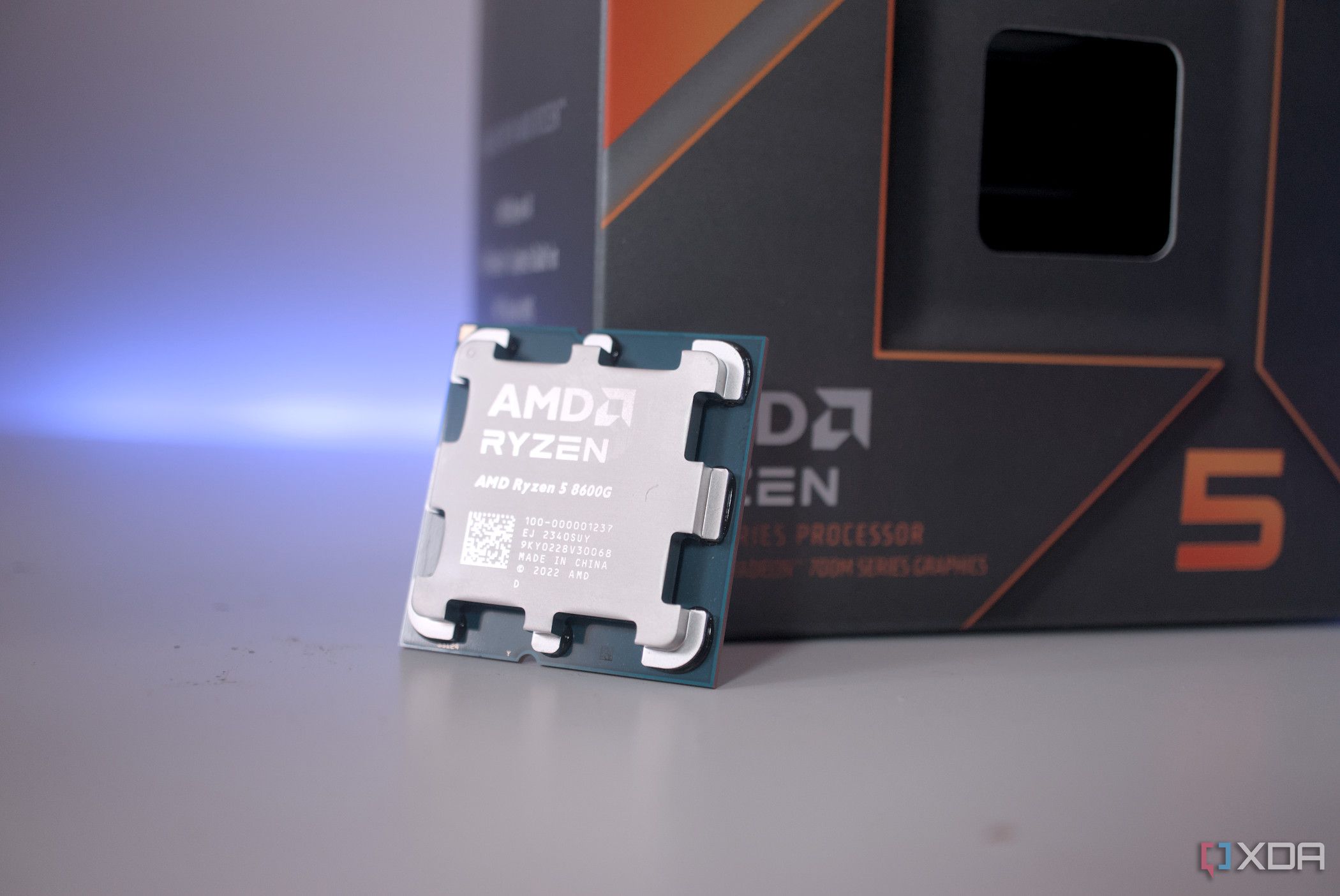 AMD Ryzen 5 8600G resting against a box