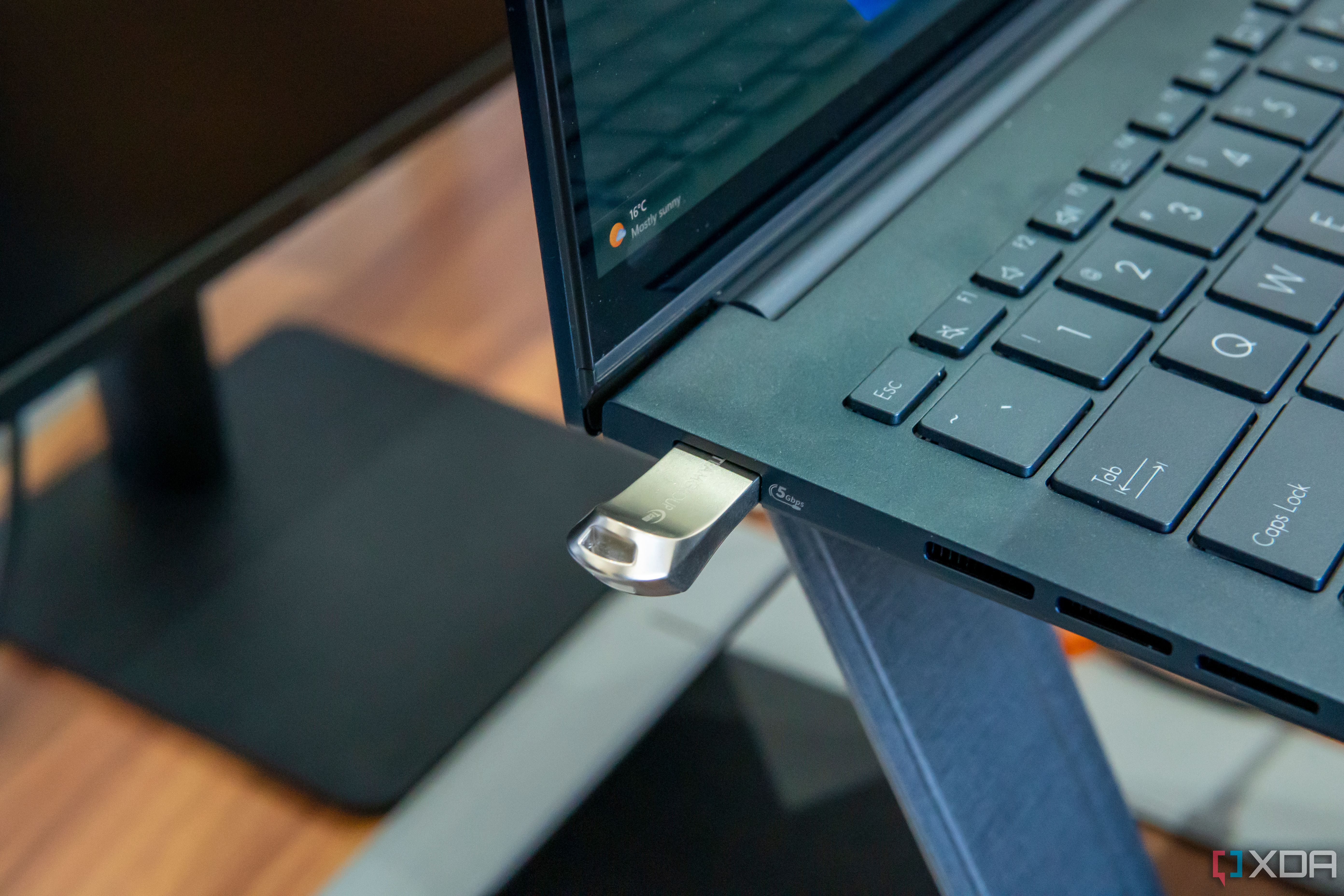 A flash drive plugged into a laptop