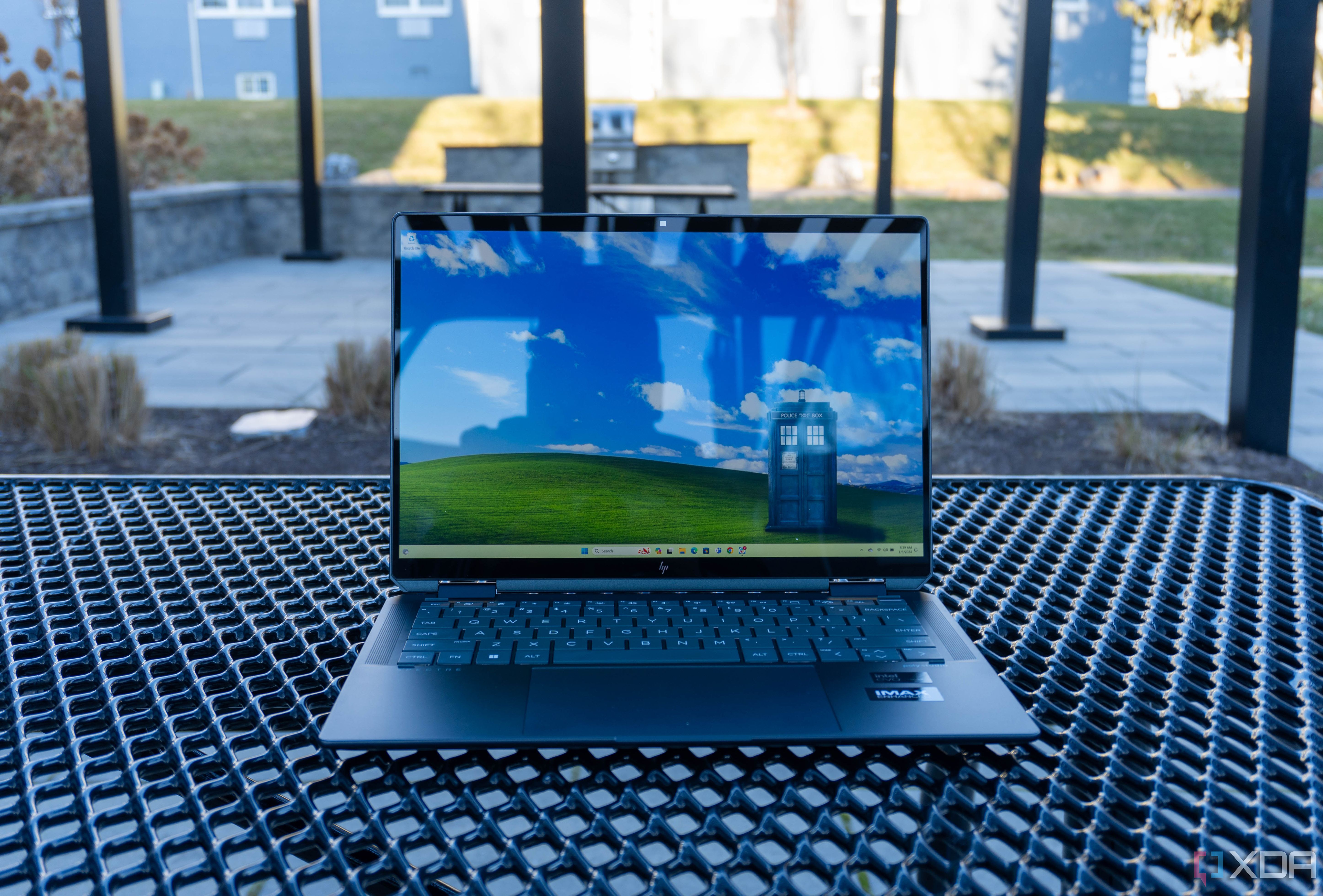 Front view of the HP Spectre x360 14 on a metal table