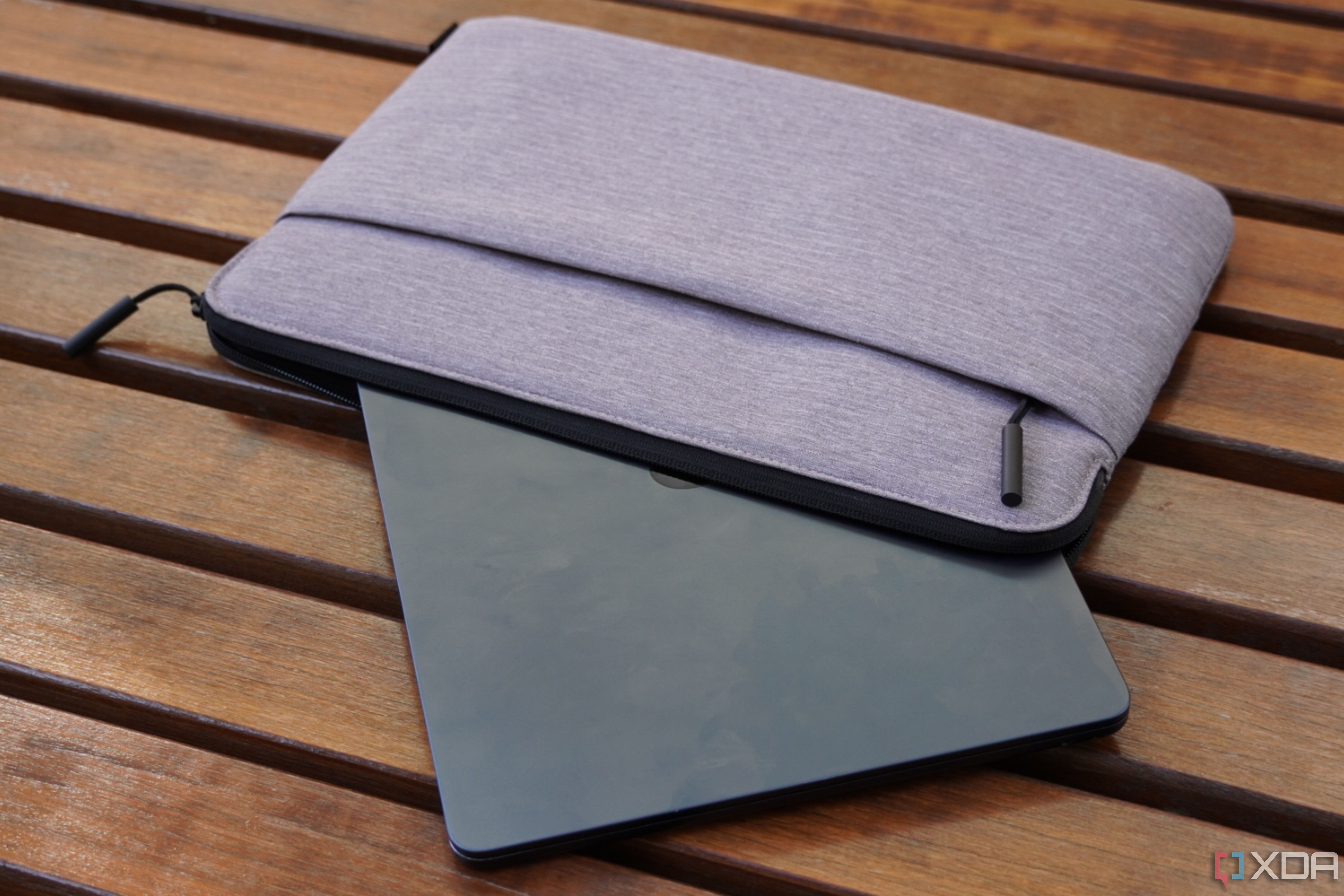 A MacBook Air half-inserted inside an Incase Go Sleeve 14.