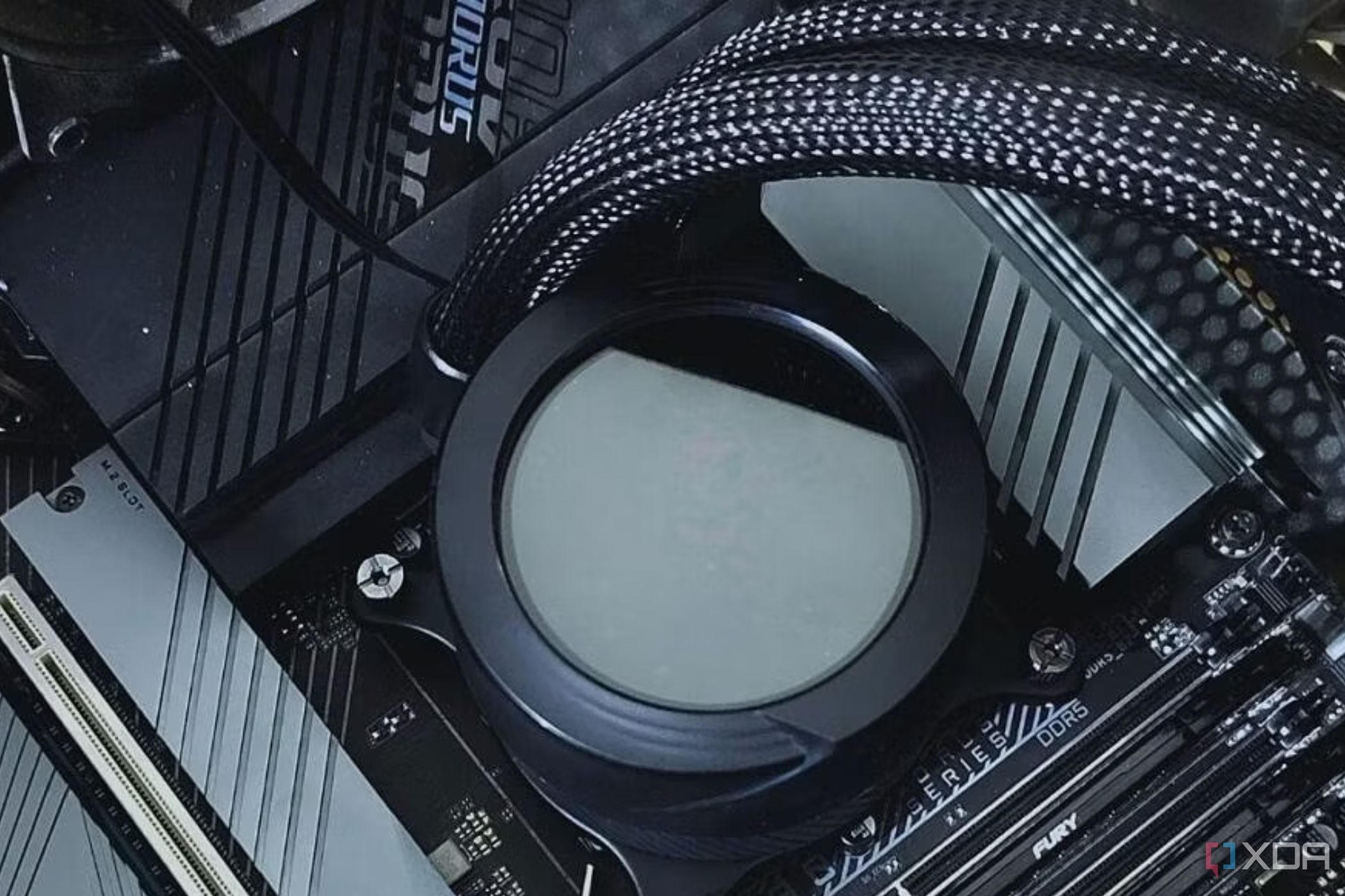 An image showing a liquid cooler waterblock mounted on a motherboard.