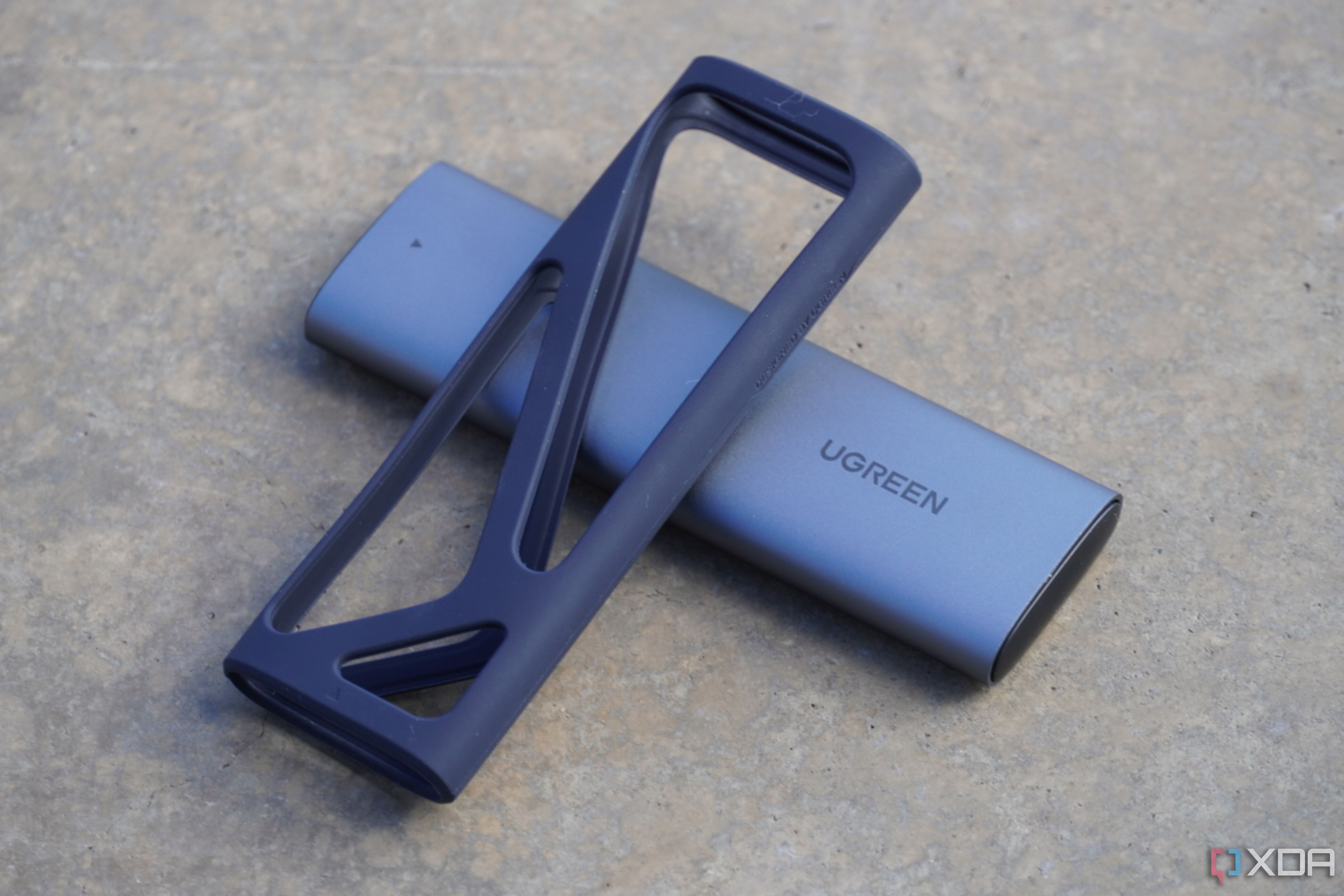 The rubber cover removed from the UGreen SSD enclosure.