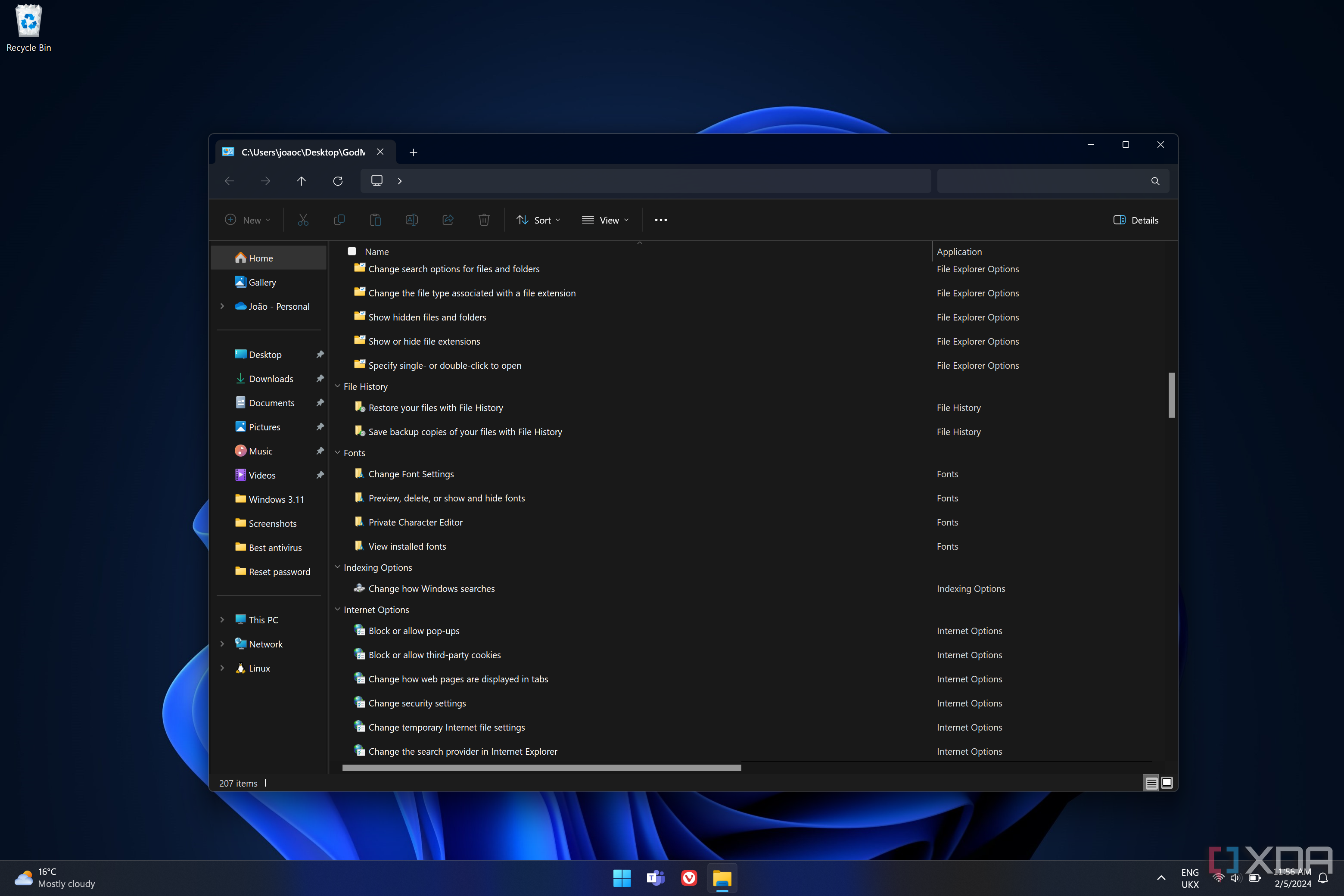 Screenshot of a Windows 11 desktop with the File Explorer displaying the God Mode folder