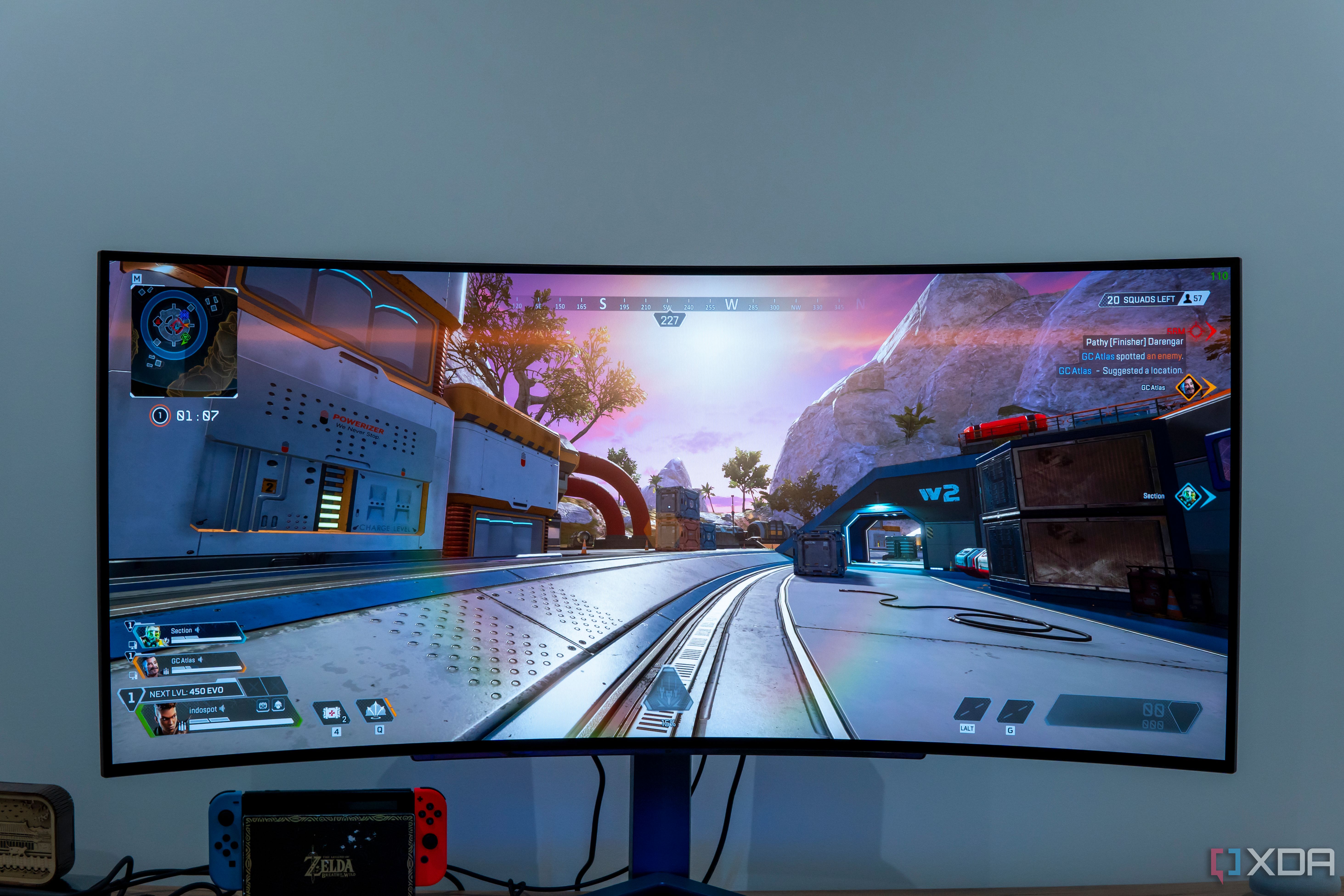 Front view of the LG UltraGear 45GR95QE displaying a bright scene in Apex Legends with the sun in front of the player