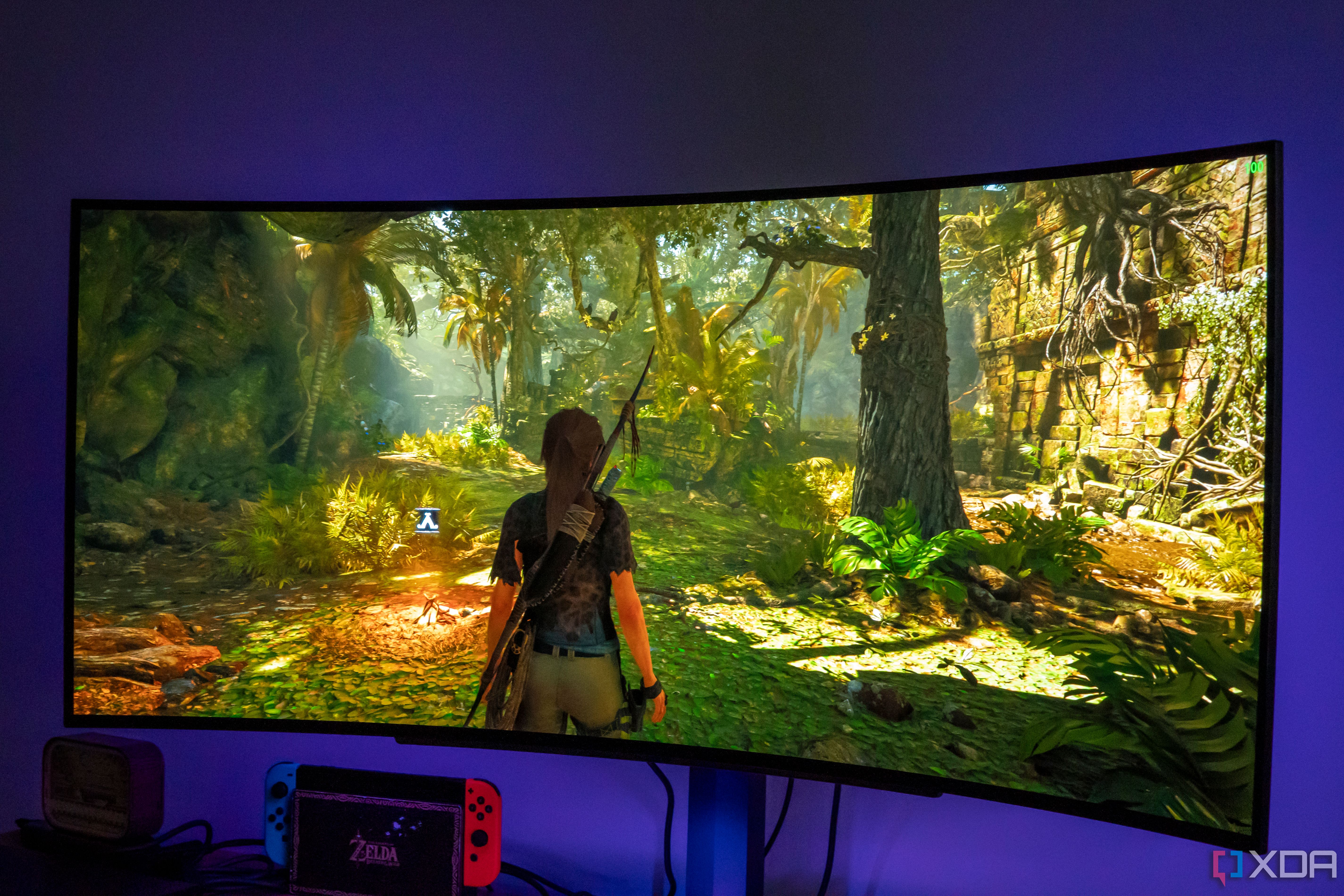 Angled front view of the LG UltraGear 45GR95QE monitor displaying Shadow of the Tomb Raider