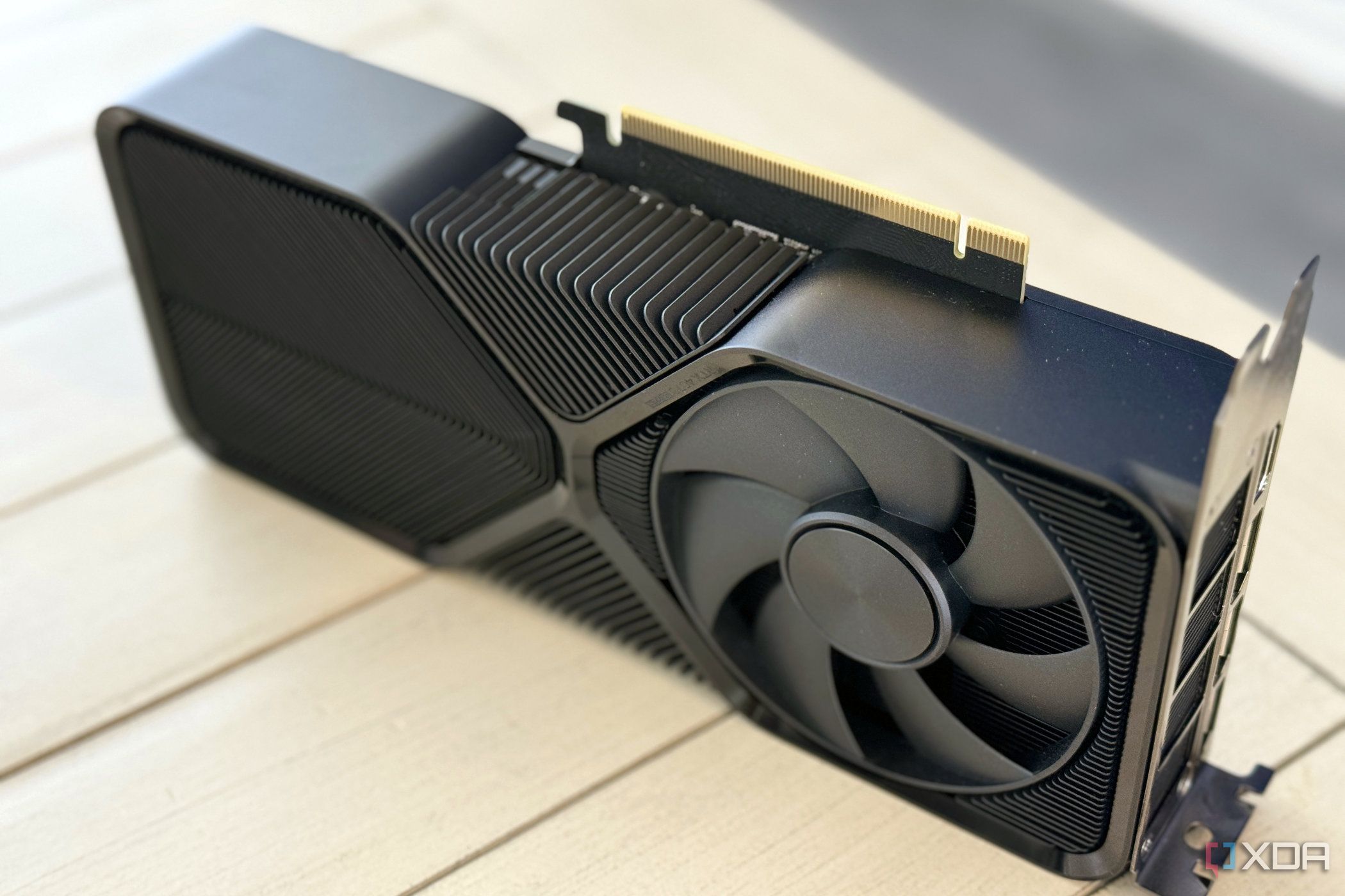 nvidia geforce rtx 4070 super founders edition stood up on table to show pcie tab