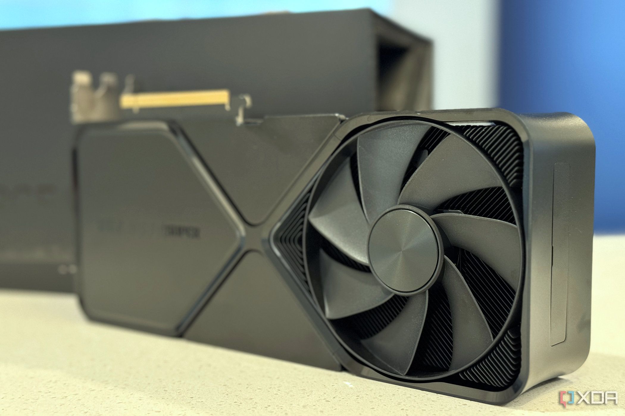 nvidia geforce rtx 4080 super fe stood up in front of its packaging