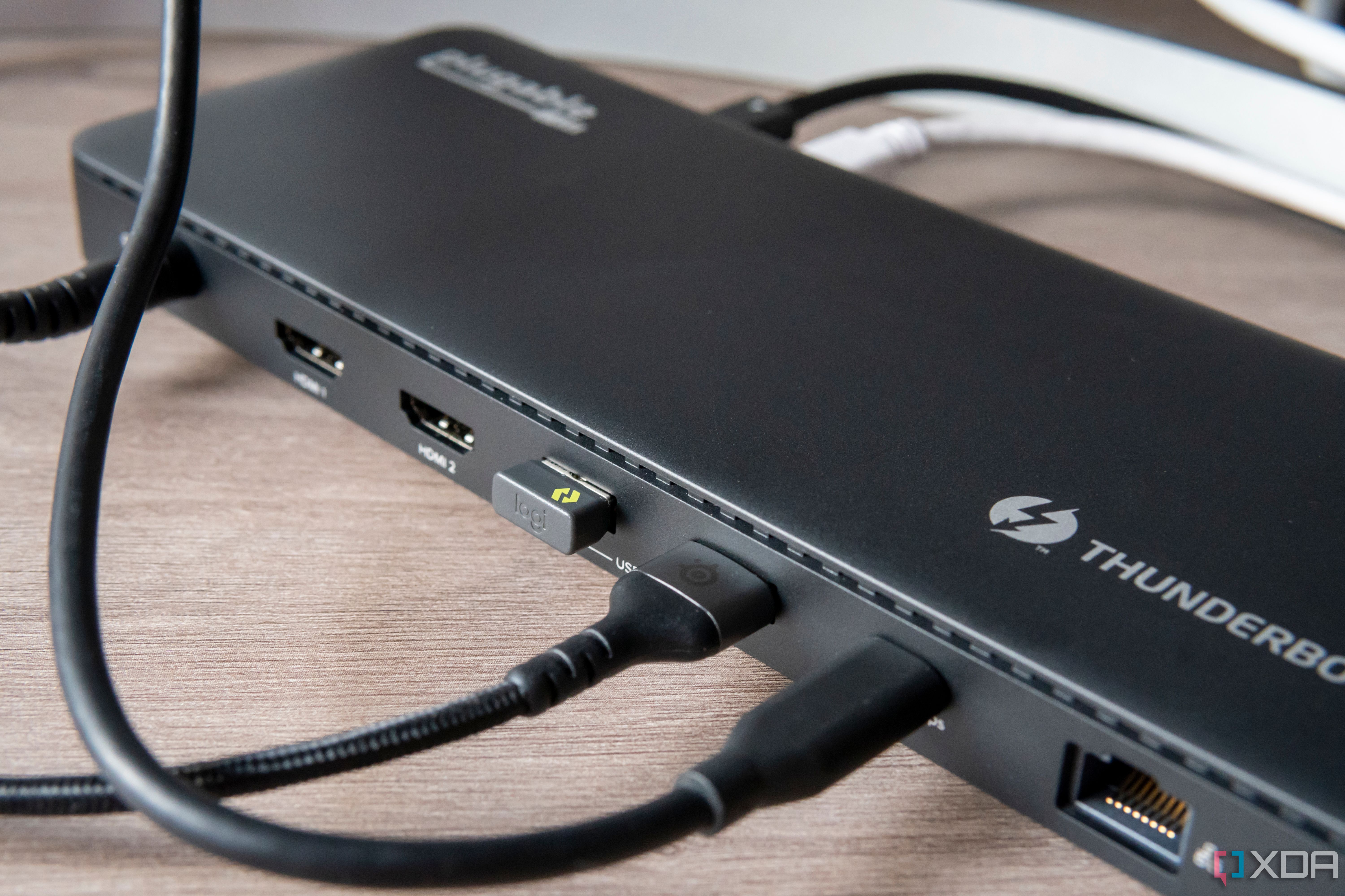 Close-up of the USB ports on the back of the Plugable TBT4-UD5 docking station with peripherals connected