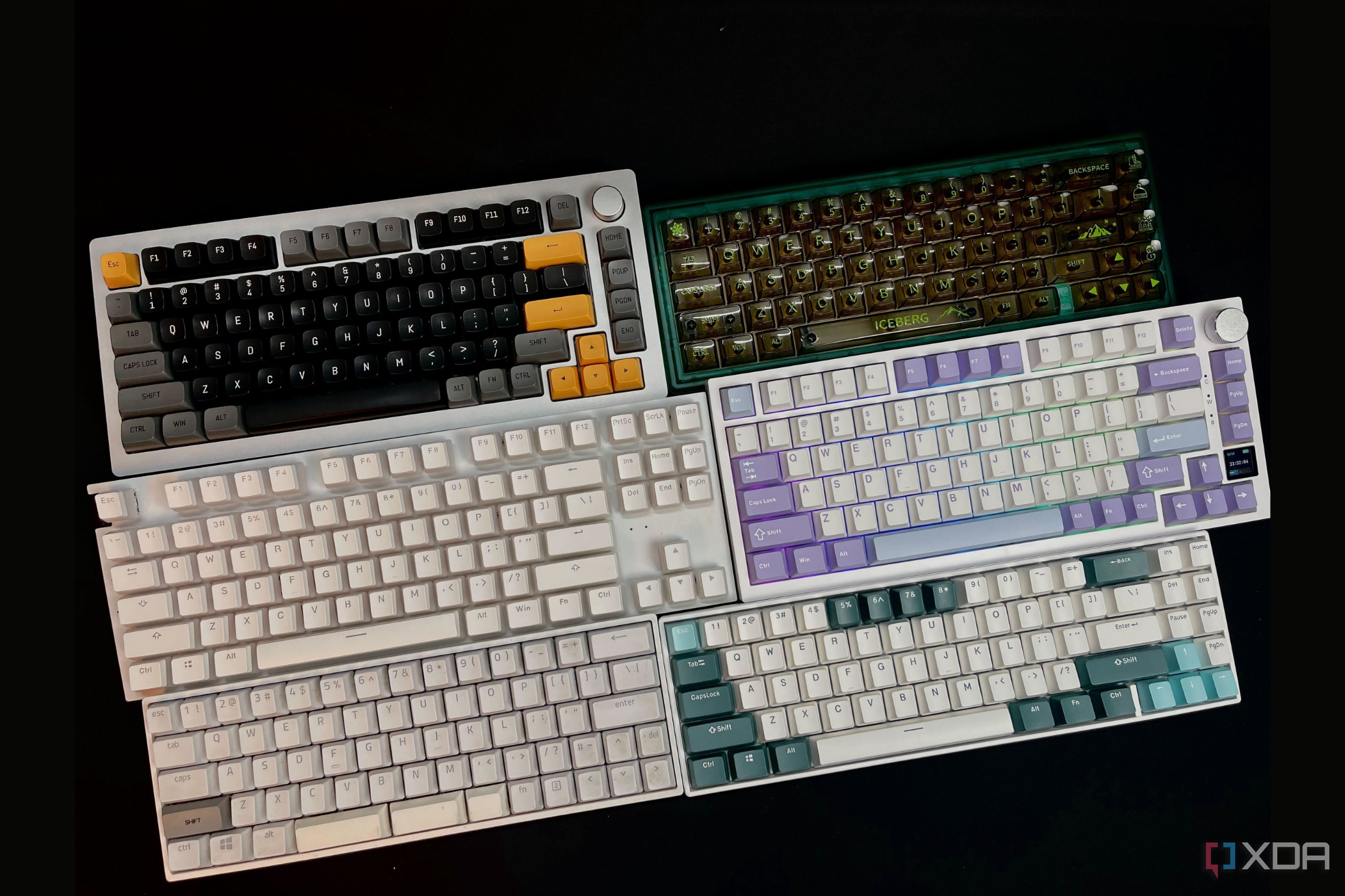 Image showing 6 mechanical keyboards incluiding Monsgeek m1 with the black and yellow keycaps, ciy gas67 with transparent keycaps, nzxt function tkl keyboard, ajazz ak 820 pro in purple blue and white keycaps, skyloong sk68 and a rk 71 in the camp green color scheme.