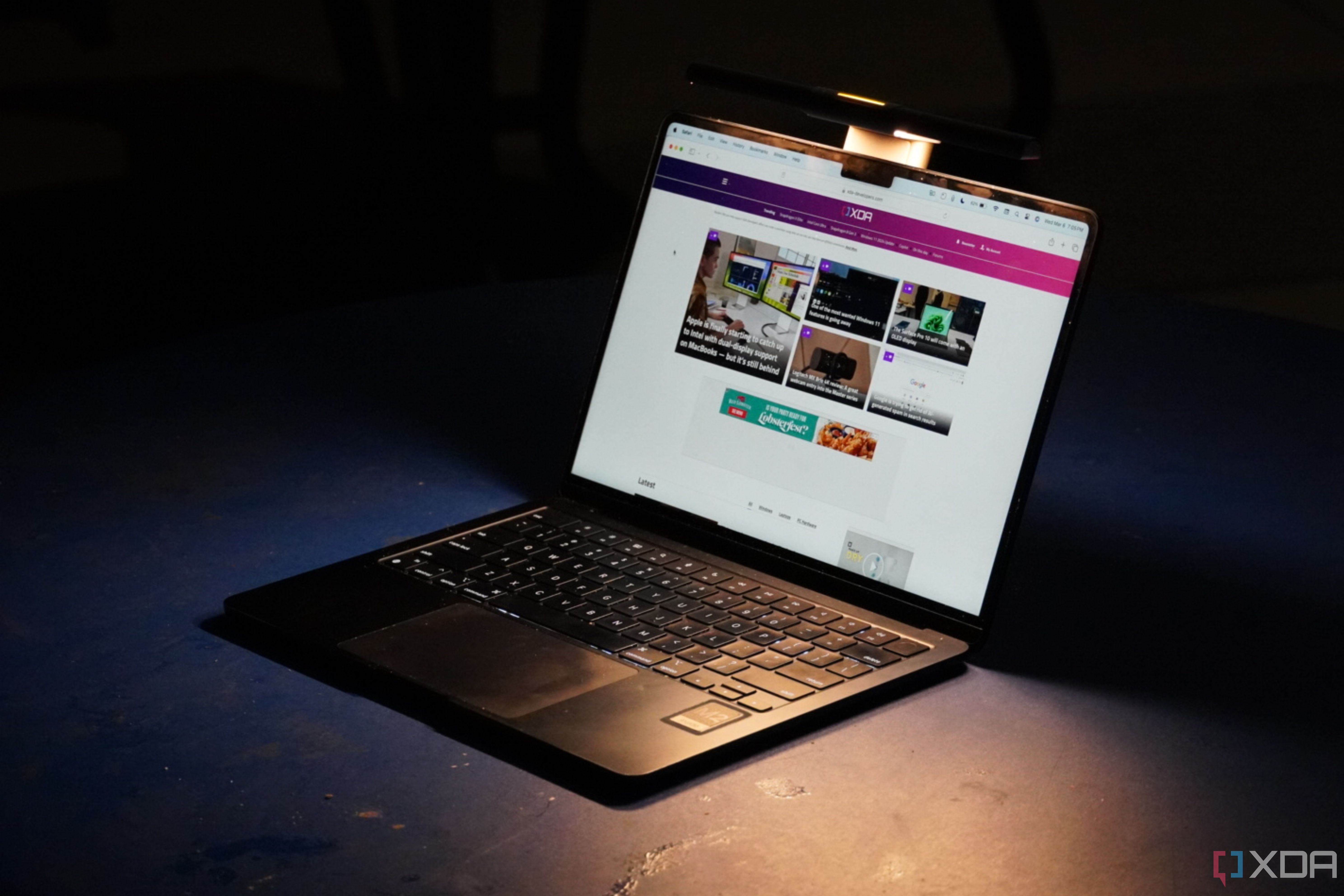The BenQ LaptopBar on an M2 MacBook Air in a dark environment. 