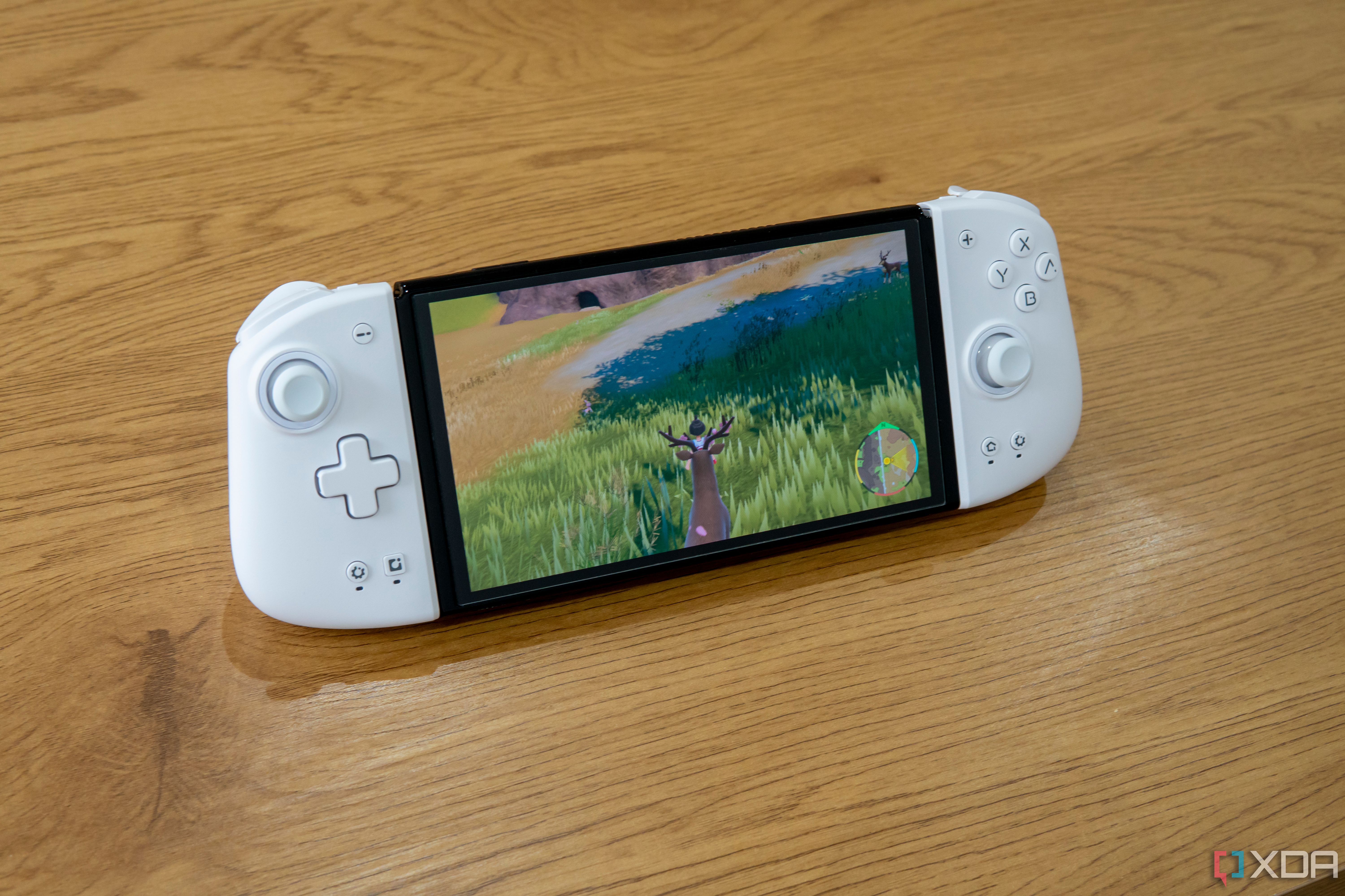 A Nintendo Switch with the Mobapad M6 HD controllers attached and playing Pokémon Violet