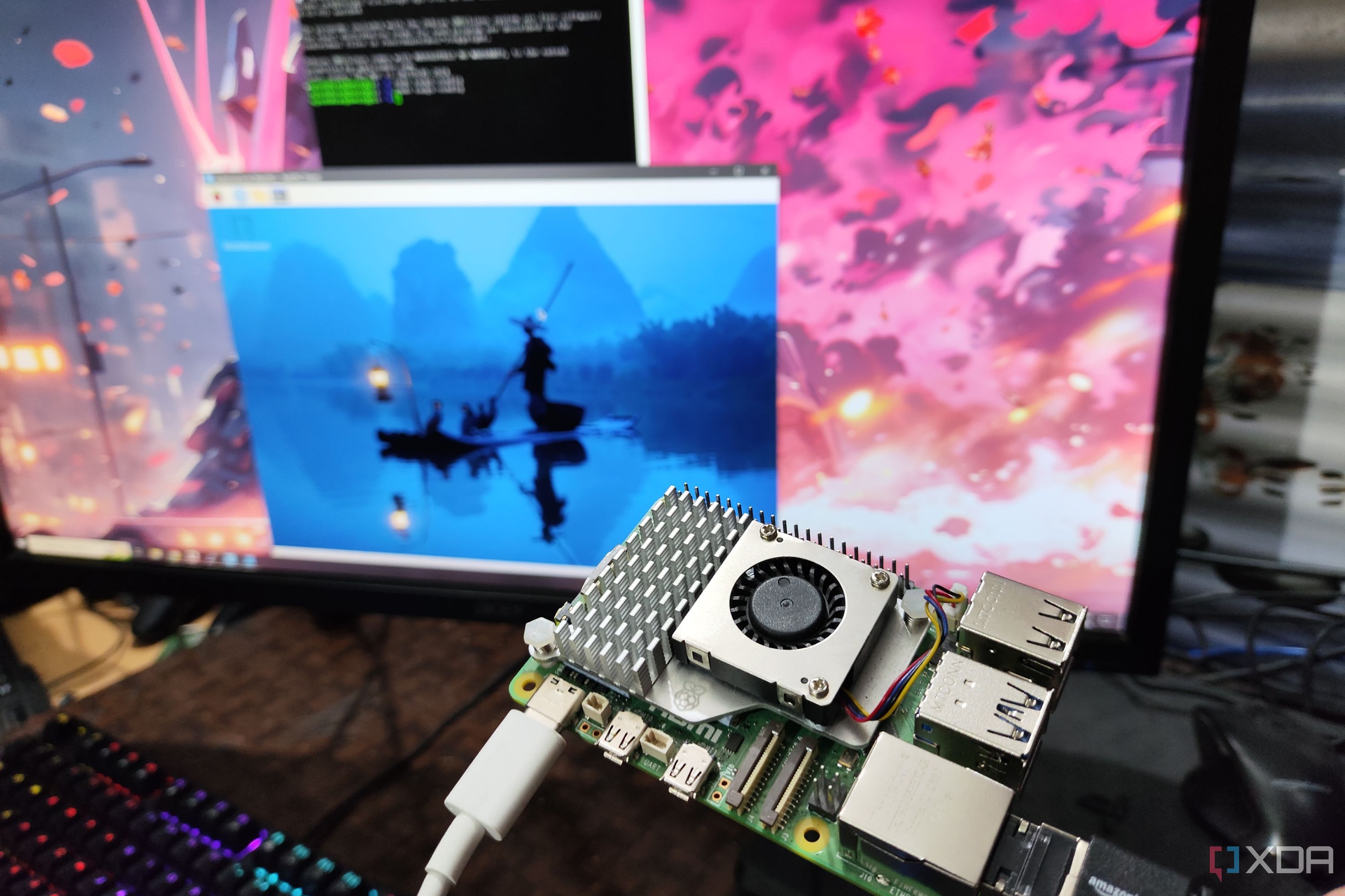 A headless Raspberry Pi, with PuTTY and RealVNC Viewer running on a monitor in the background